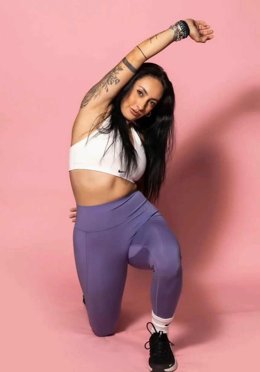 Kat Novoa, Latina wellness entrepreneur and founder of Babes of Wellness, in a confident studio portrait