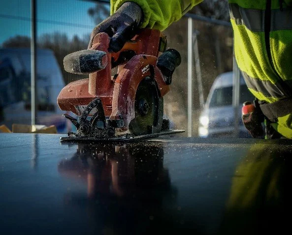 Close-up piture  of a circular saw cutting.