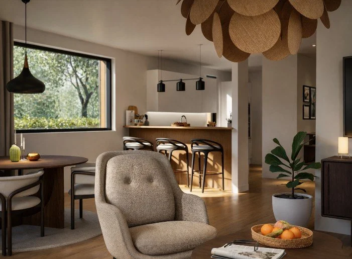 Modernt vardagsrum i nybyggt hus i Skåne med öppen planlösning, kök med köksö och stora fönster mot trädgård.
