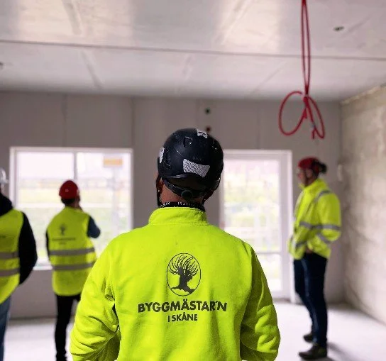 Picture of a employer standing with his back towards the camera.