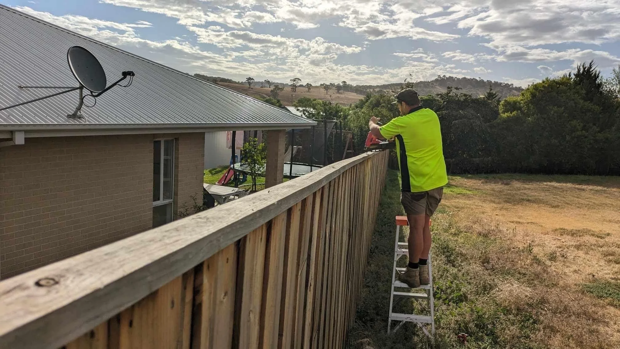 Oranssi carpenter using bench saw