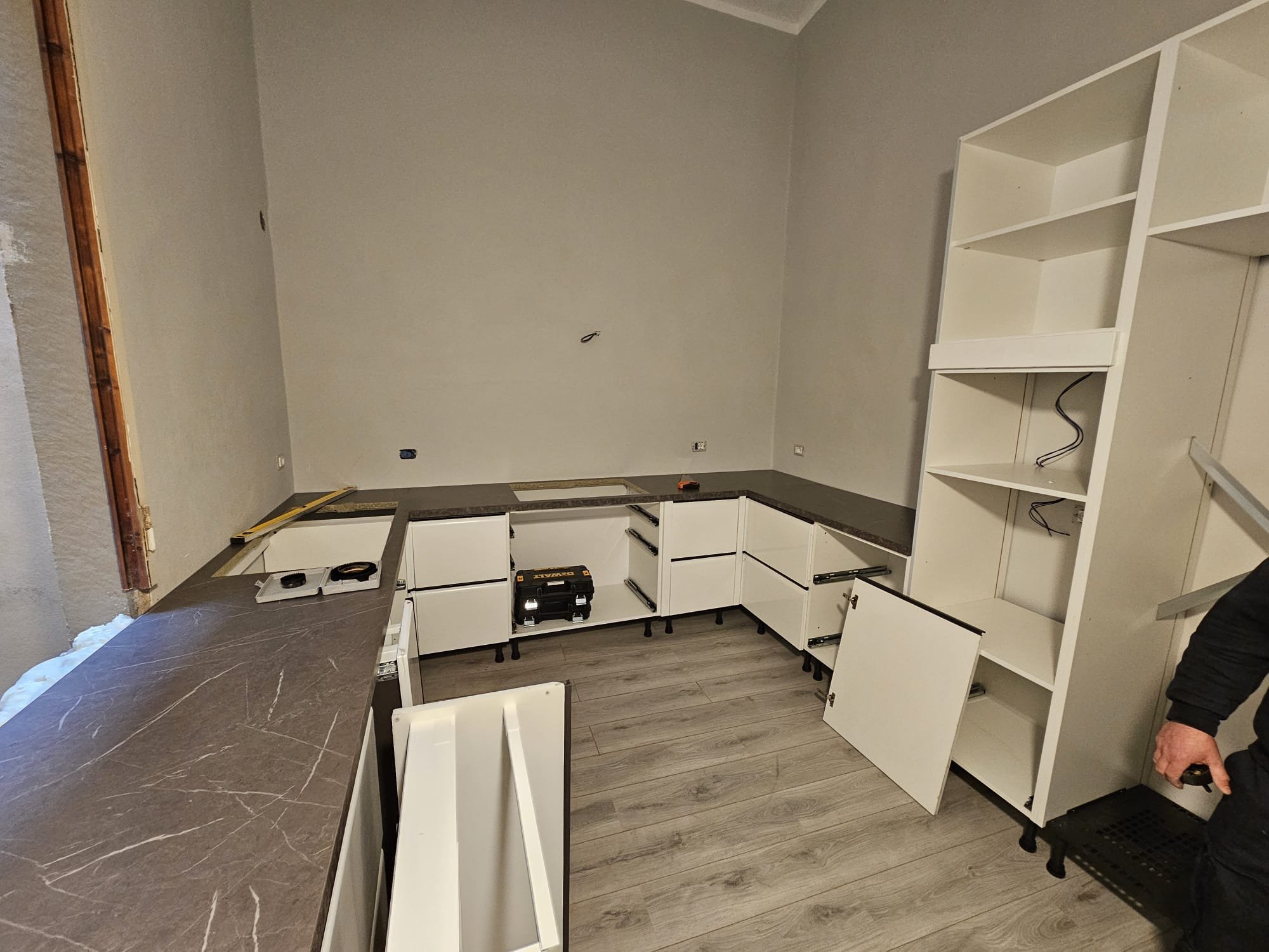 Cupboards being put in
