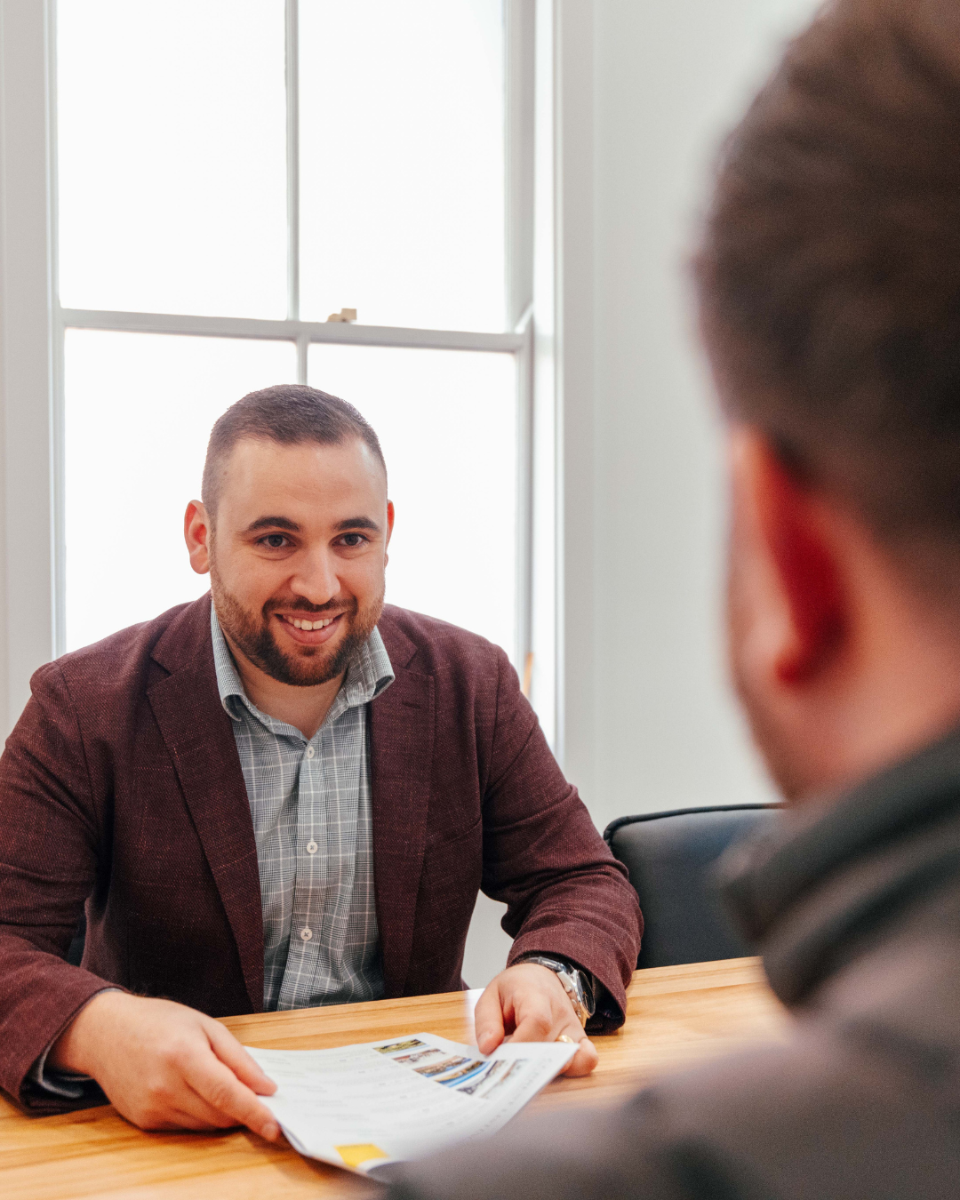 Shorebreak Finance team member meeting with a client in Berry