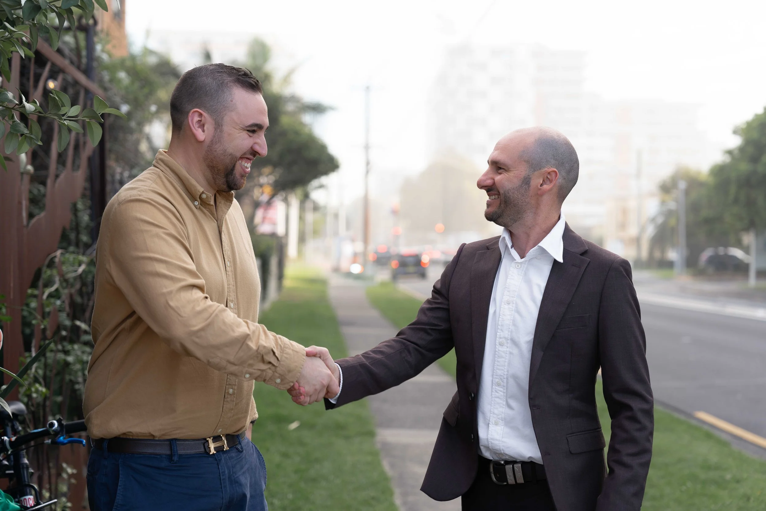 Shorebreak Finance team members shaking hands