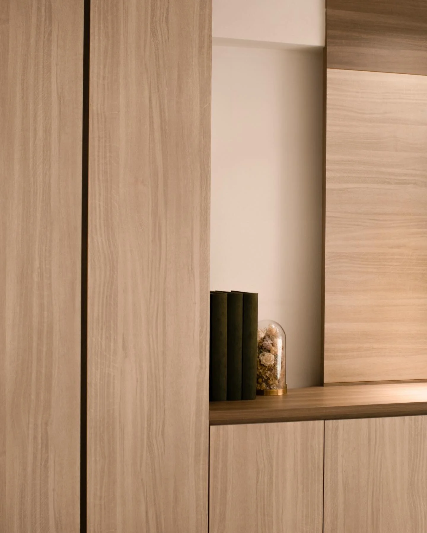 Integrating custom-built carpentry can help create a cohesive interior design, minimizing visual clutter with designated spaces tailored for your specific items. Cheers to a peaceful physical and mental environment. 

Project: Residential / Punggol, 