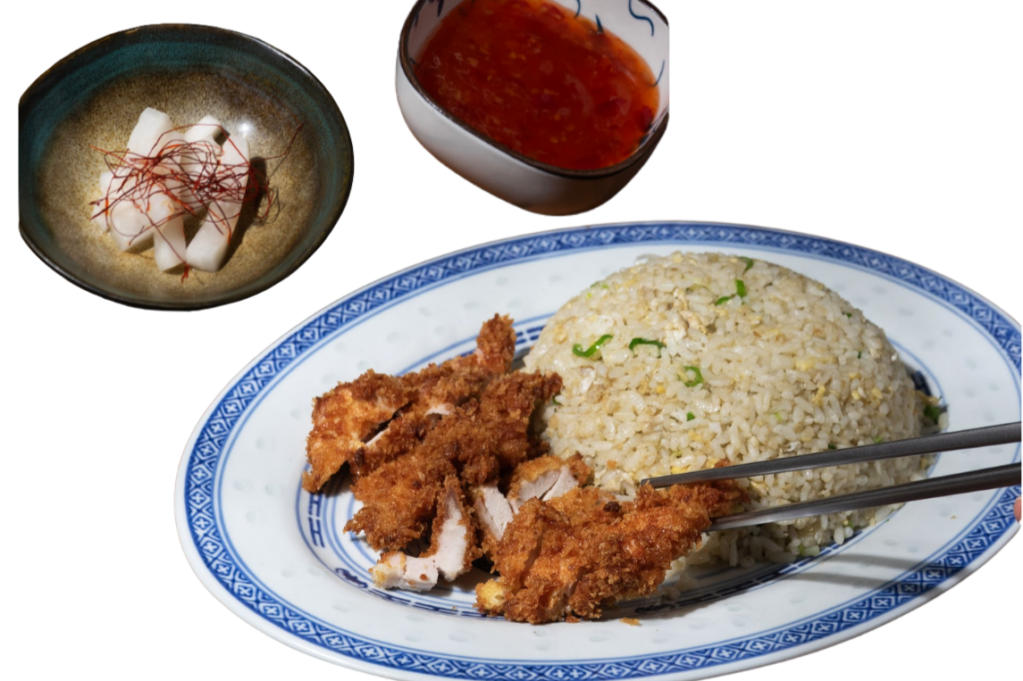 Fried chicken with rice on a white and blue patterned plate, a bowl of red sauce, and a small bowl of tofu with chili oil and shredded chili peppers.