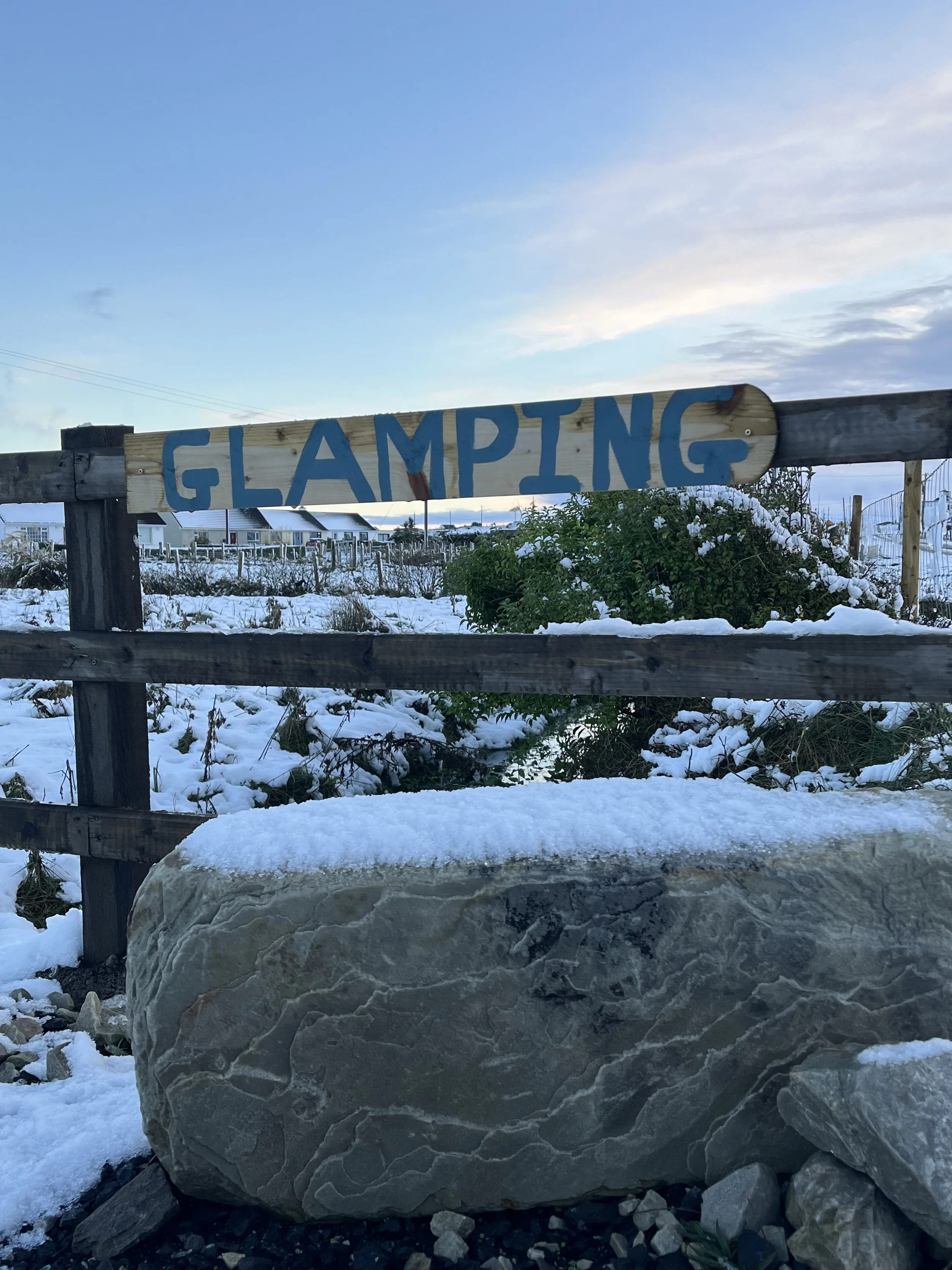 20241222 Glamping sign in snow.jpeg
