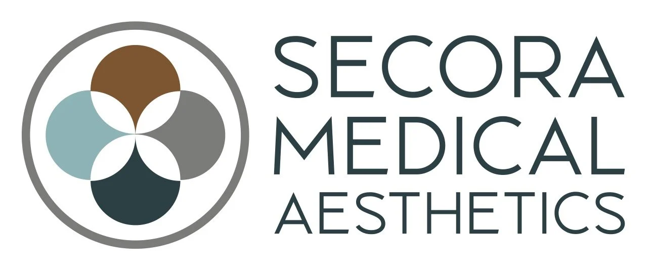 Clean, professional medical spa treatment room with neutral tones at Secora Medical Aesthetics in Littleton