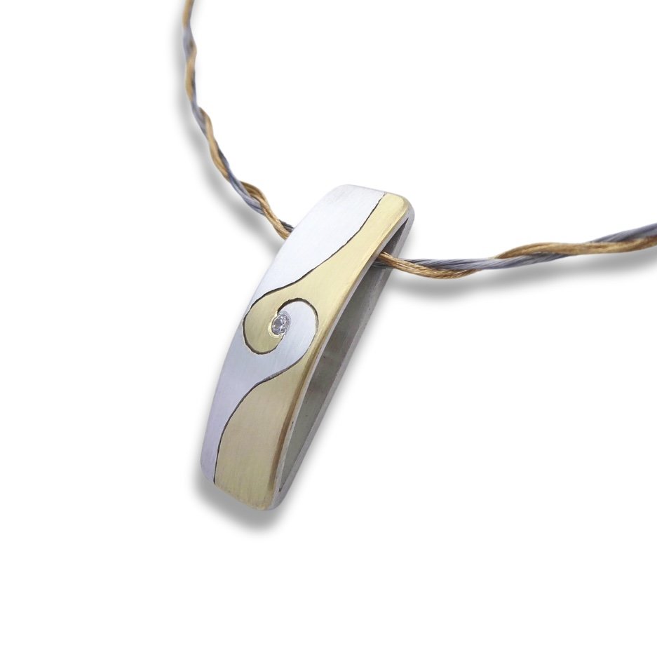Spiral silver and brass necklace with a facet