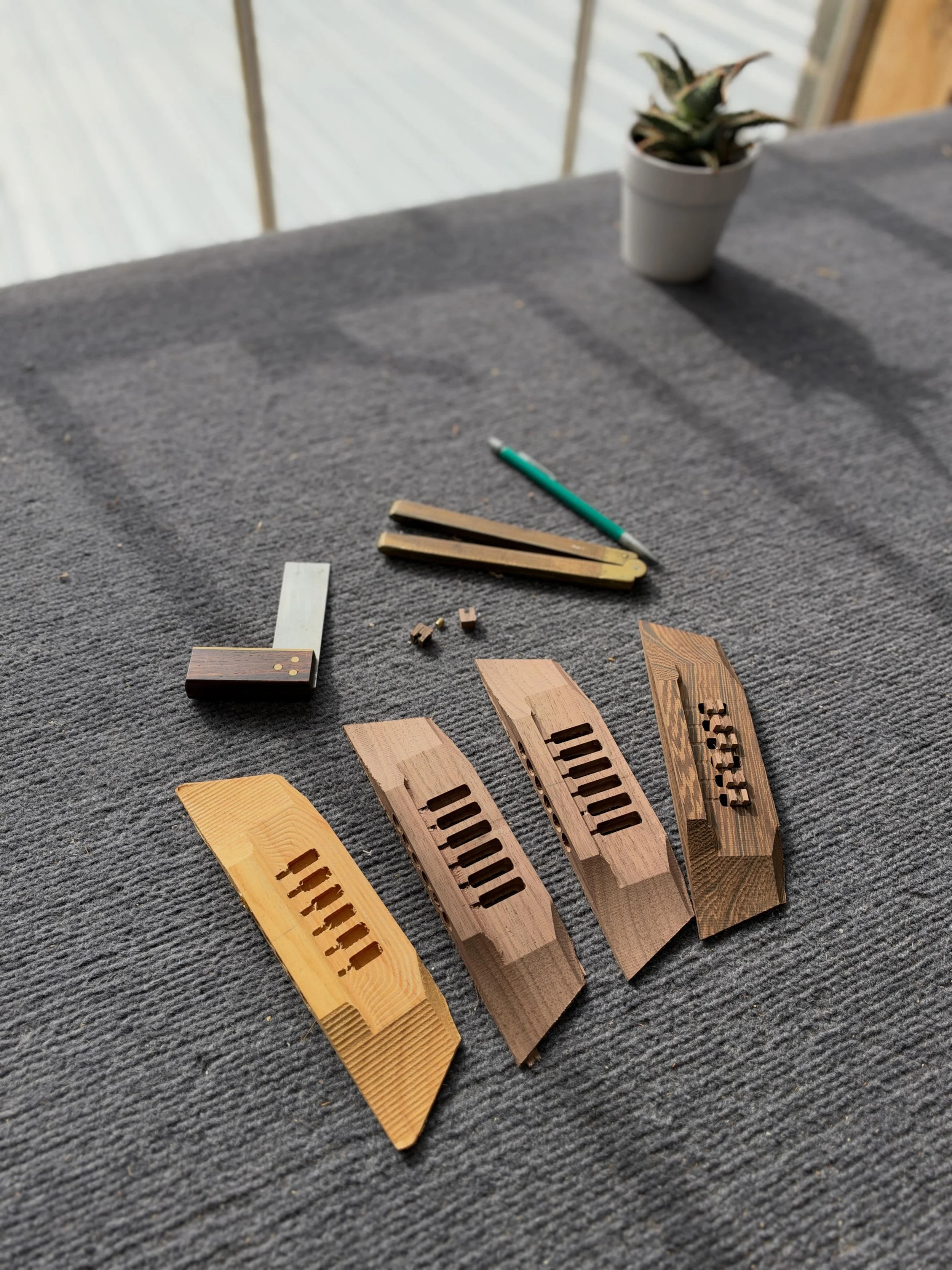 All the prototypes! Getting closer to a design I&rsquo;m happy with for a rear-loading, adjustable intonation, adjustable action, acoustic bridge. Probably a couple more iterations to go, but it&rsquo;s getting there&hellip;