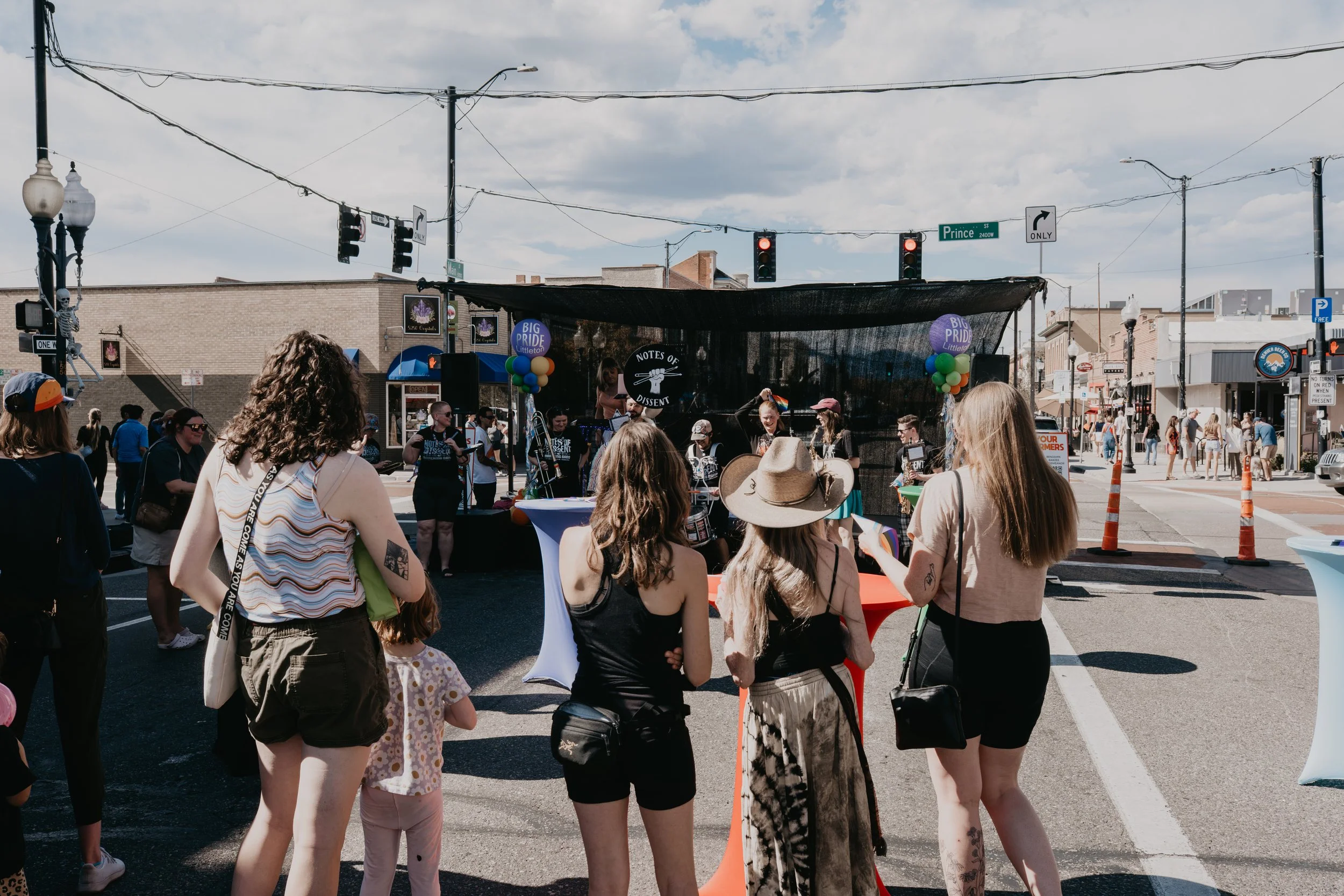 Crowd watching a live band perform at a Pride street festival in Littleton, Colorado.
