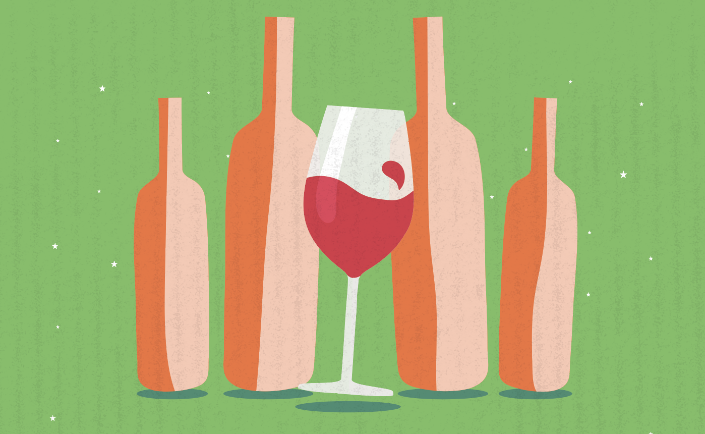 Orange wine bottles on a green background with a glass of red wine