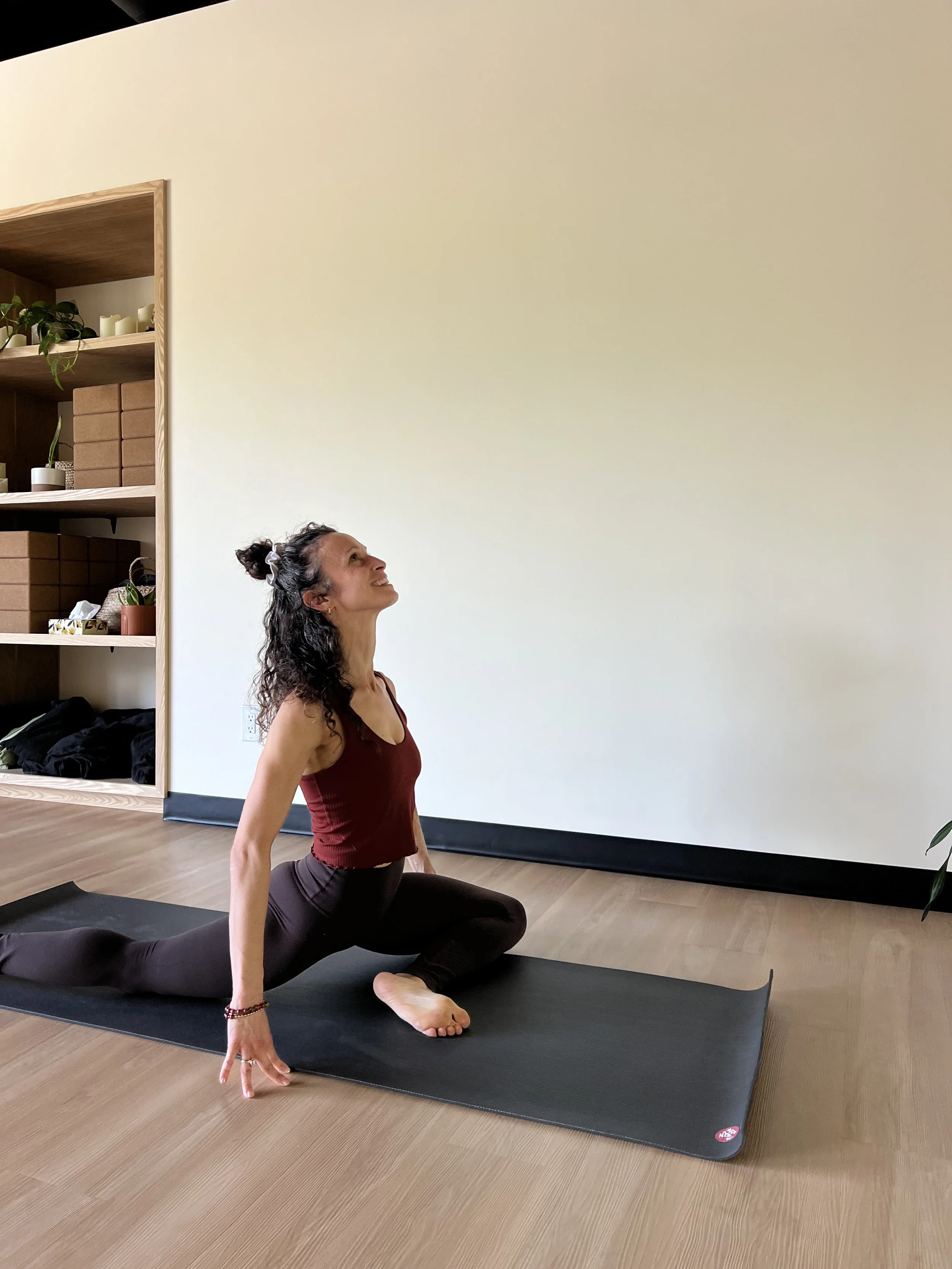 Sari , Rogue Instructor, in pigeon pose