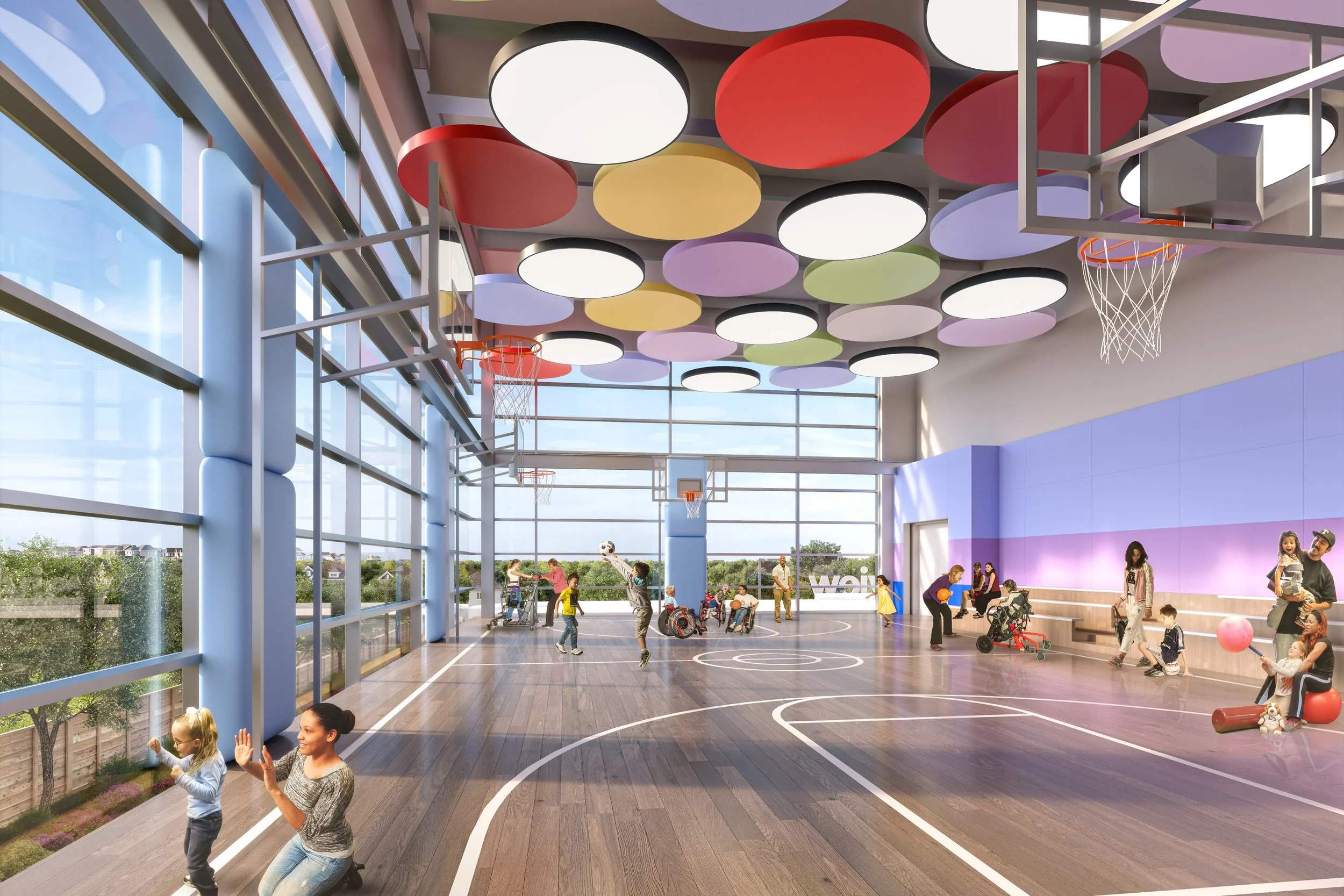 Indoor gymnasium with wooden flooring, colorful ceiling lights, basketball hoops, and children playing, some with wheelchairs and some with balls, alongside adults supervising. Education. Inspiration for Toronto, Dallas, Park city.