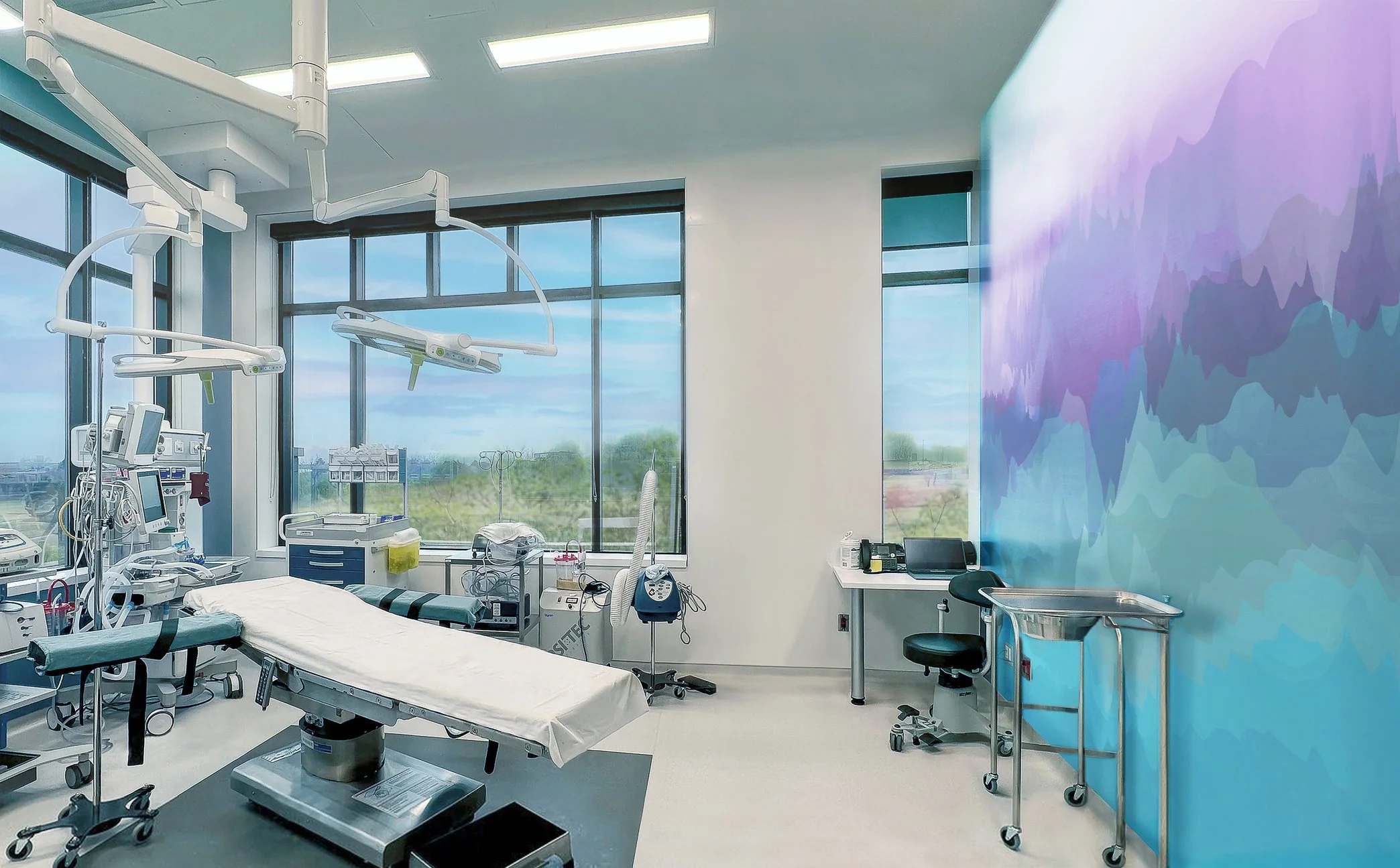 Modern hospital room with medical equipment, hospital bed, and a large window revealing a cloudy sky outside.