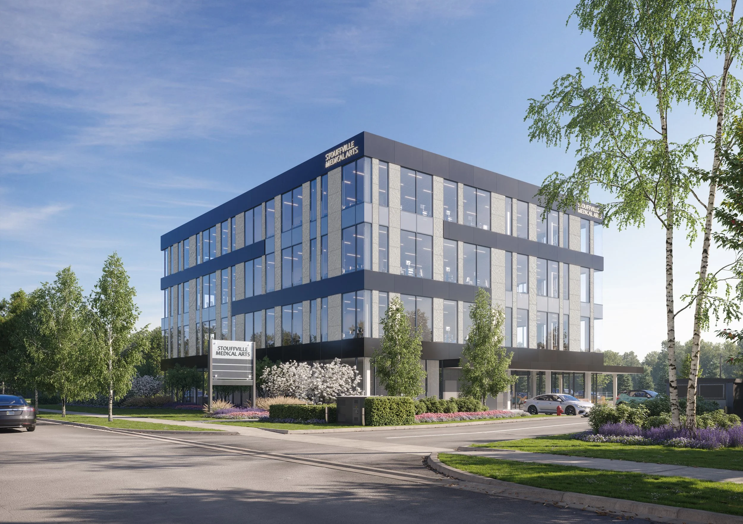 Modern multi-story healthcare building with glass windows and a sign that reads 'Stouffville Medical Arts.'  There is a parking lot with cars and a well-maintained landscape. Good inspiration for Toronto, Dallas and Park City.