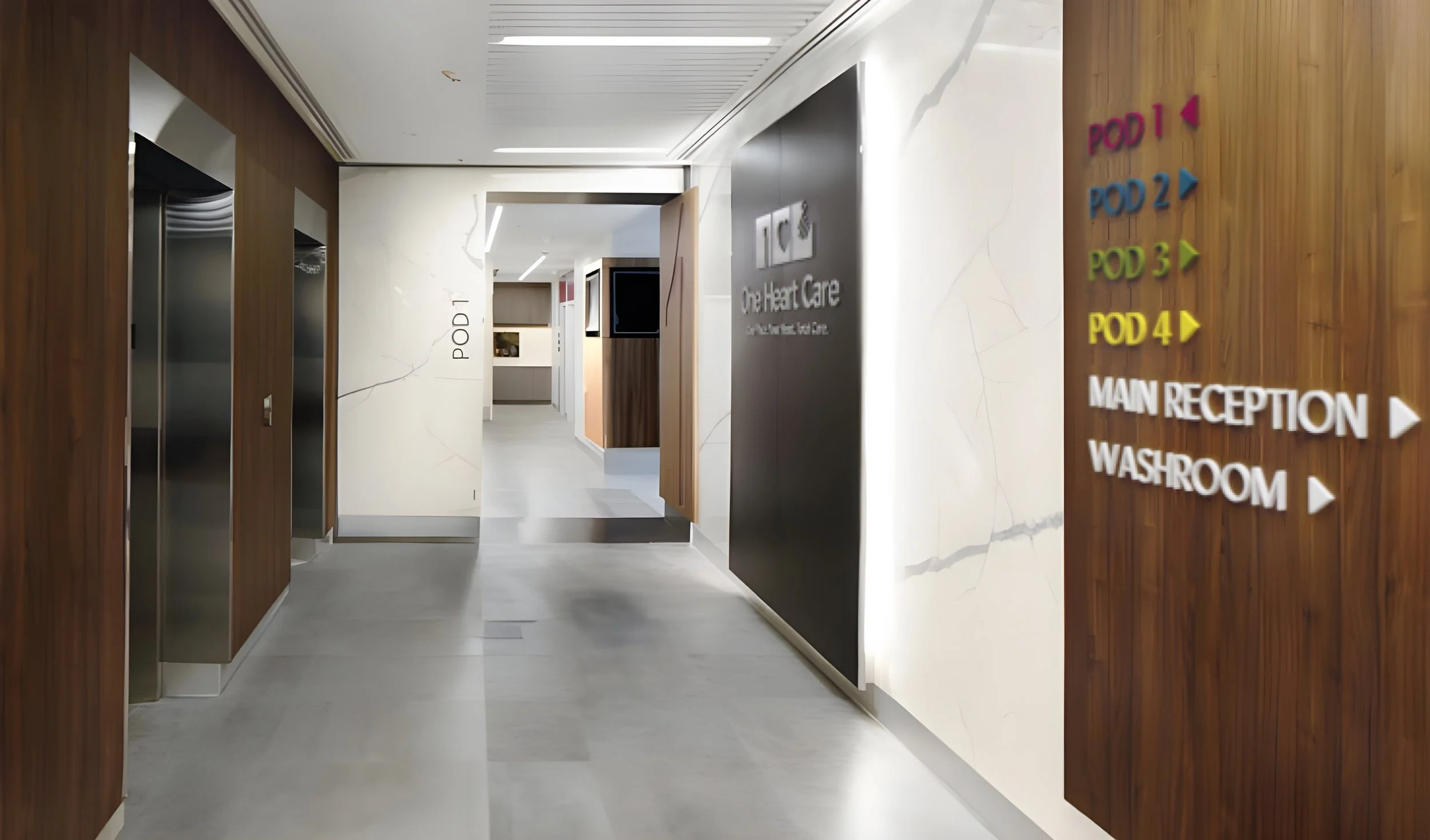 Hallway in a modern medical facility with directional signs for different patient care pods, main reception, and washroom. Wellbeing and flow, salutogenic design. Healthcare architecture. Good inspiration for Toronto, Dallas and Park City.
