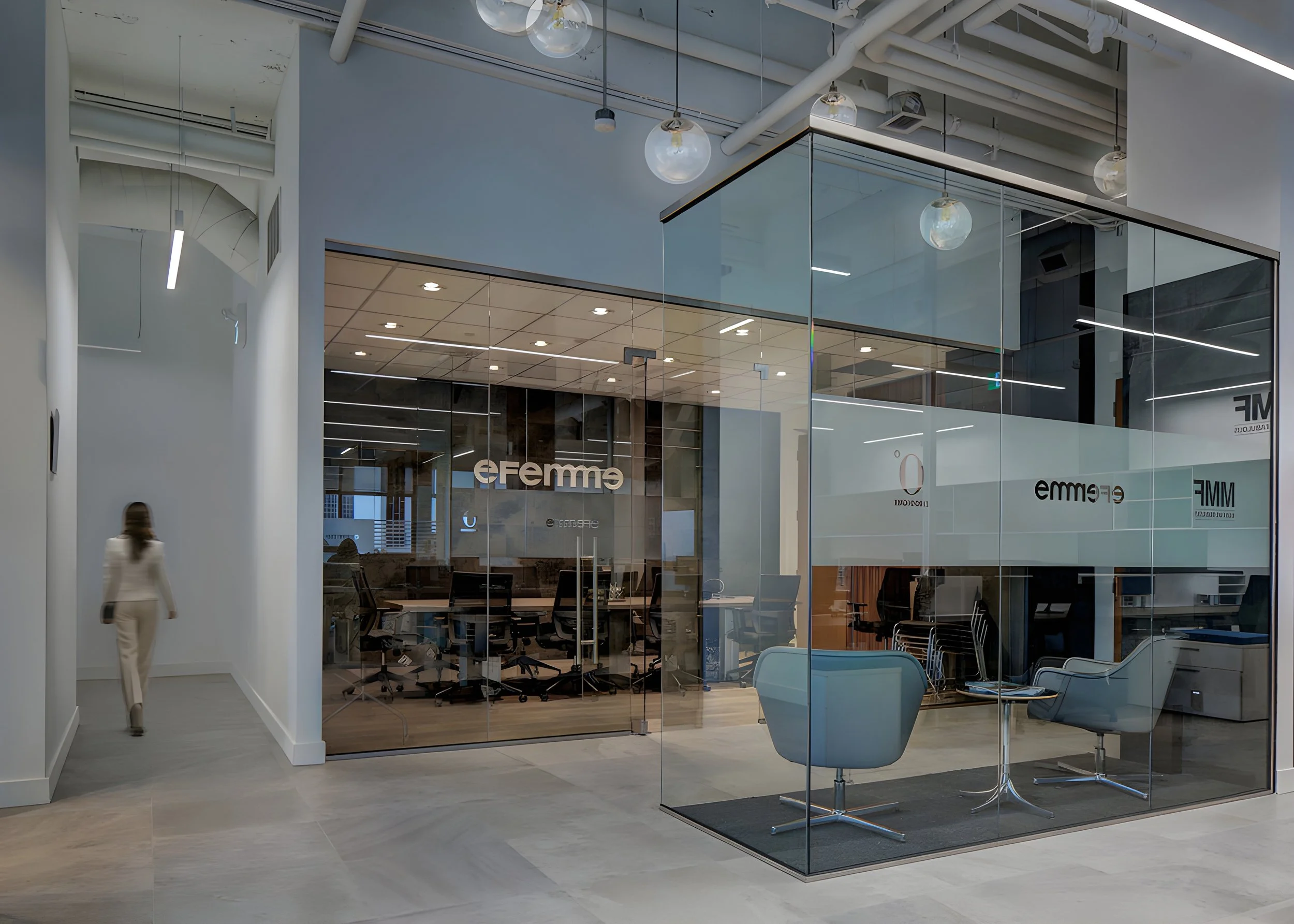 Modern office space with glass walls, white chairs, and a conference table. The ceiling has exposed pipes and globe-shaped pendant lights. The interior design is sleek and contemporary. Education. Toronto, Dallas, Park city, Texas, Miami.