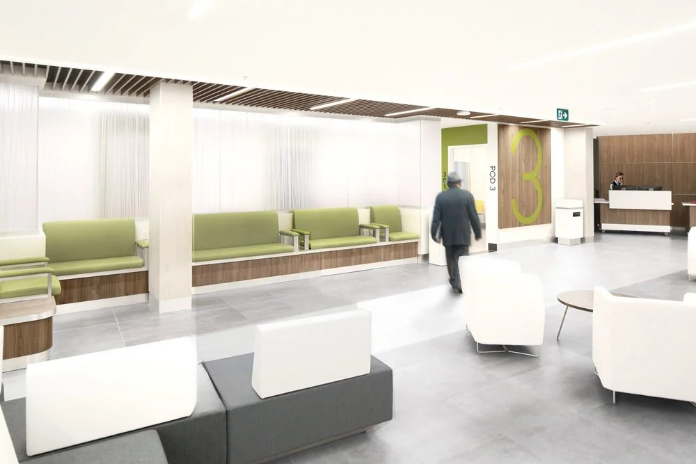 Healthcare waiting area with green and white seating, a man walking, and a reception desk in the background. easy wayfinding, helps with flow of patients and healthcare workers. Good inspiration for Toronto, Dallas and Park City.
