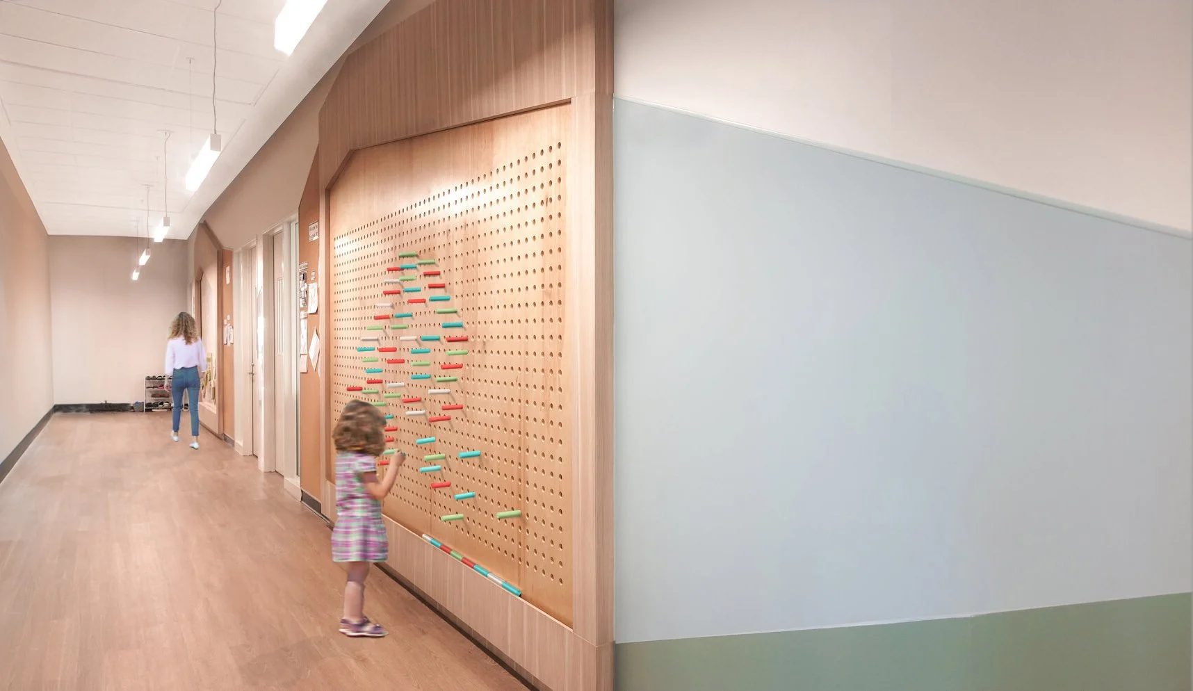 A hallway with a wooden wall featuring a colorful pegboard and kids playing near it. education, wellbeing. salutogenic design. wayfinding, human. inspiration for Toronto, Dallas, Texas, Miami, and Park City.