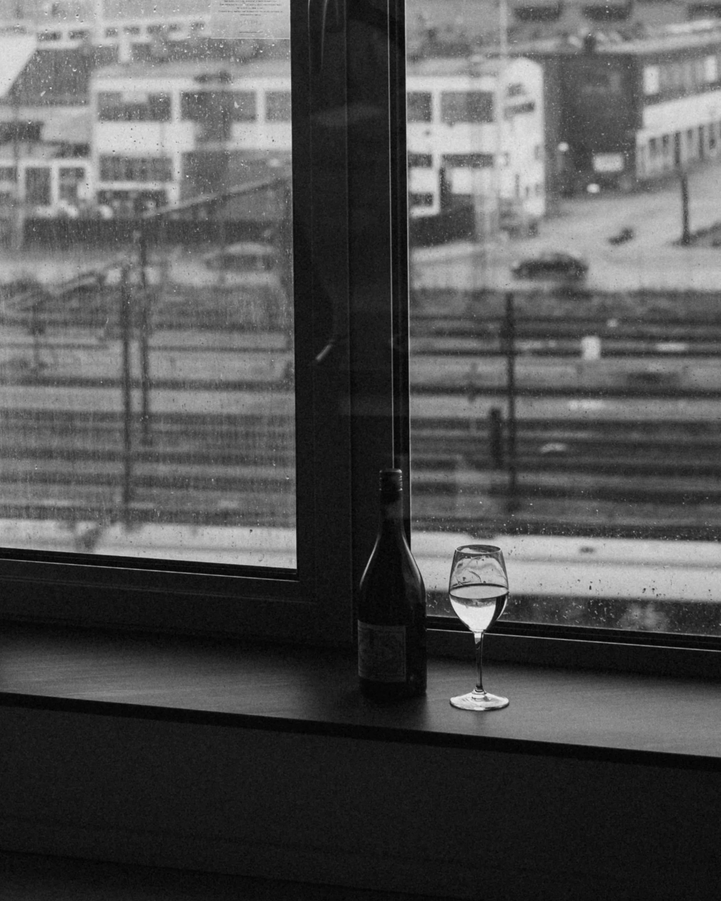 black and white photography with glass of wine