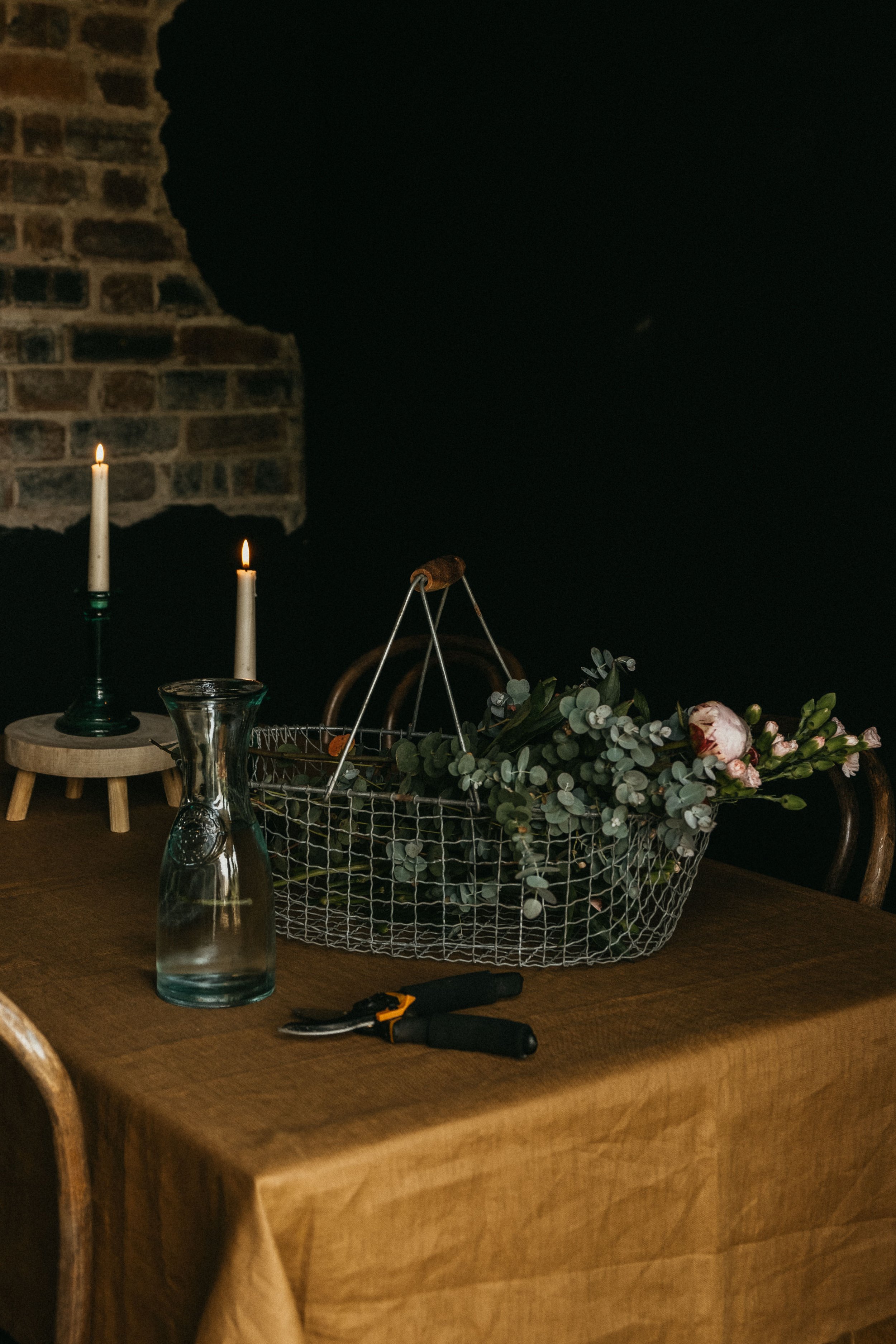 Vintage home decor, vintage style home, exposed brick wall, Vintage wire basket, peonies bouquet, peonies and eucalyptus, peonies and carnations bouquet, flower basket, vintage dining room