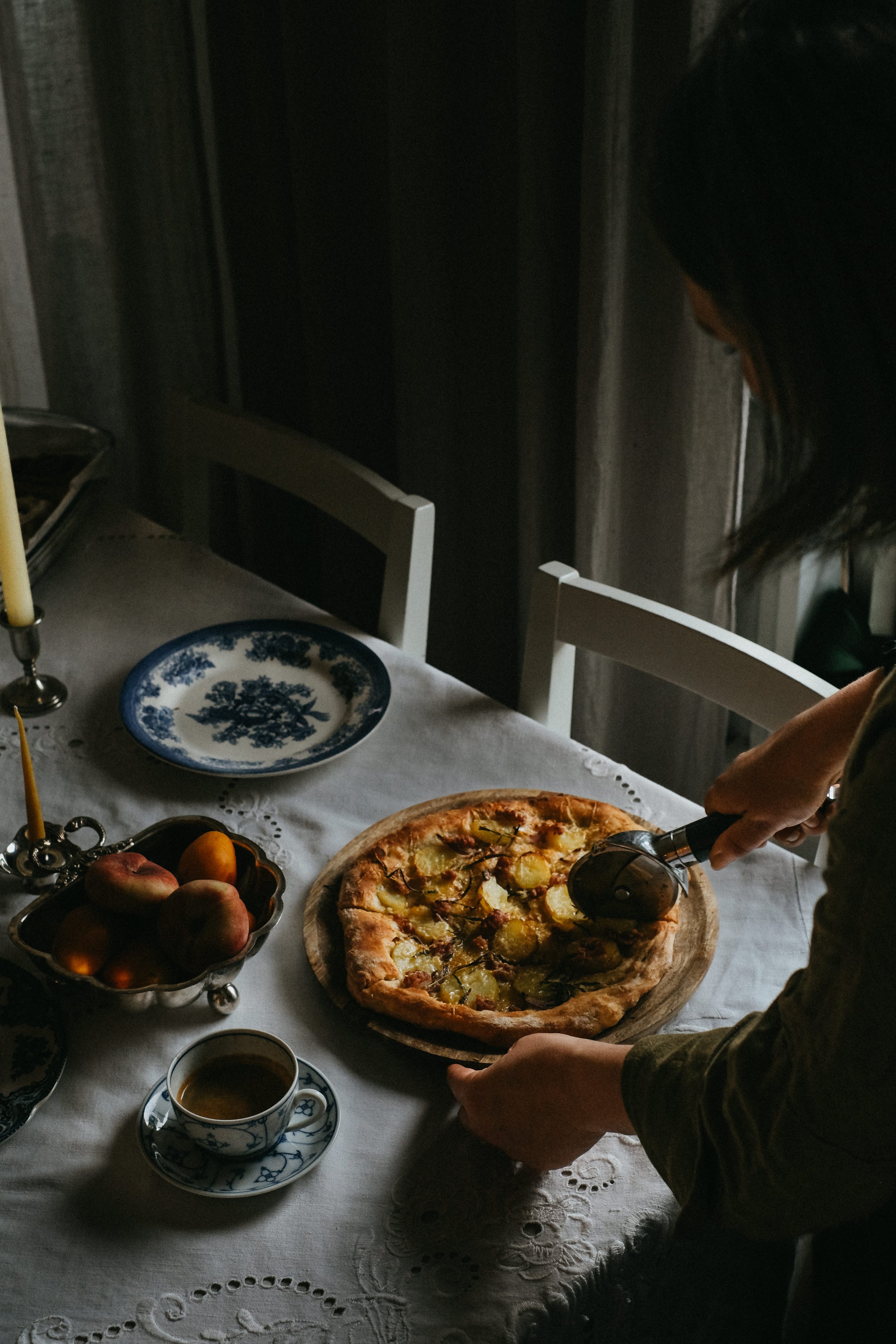 moody food photography, homemade pizza on antique plates