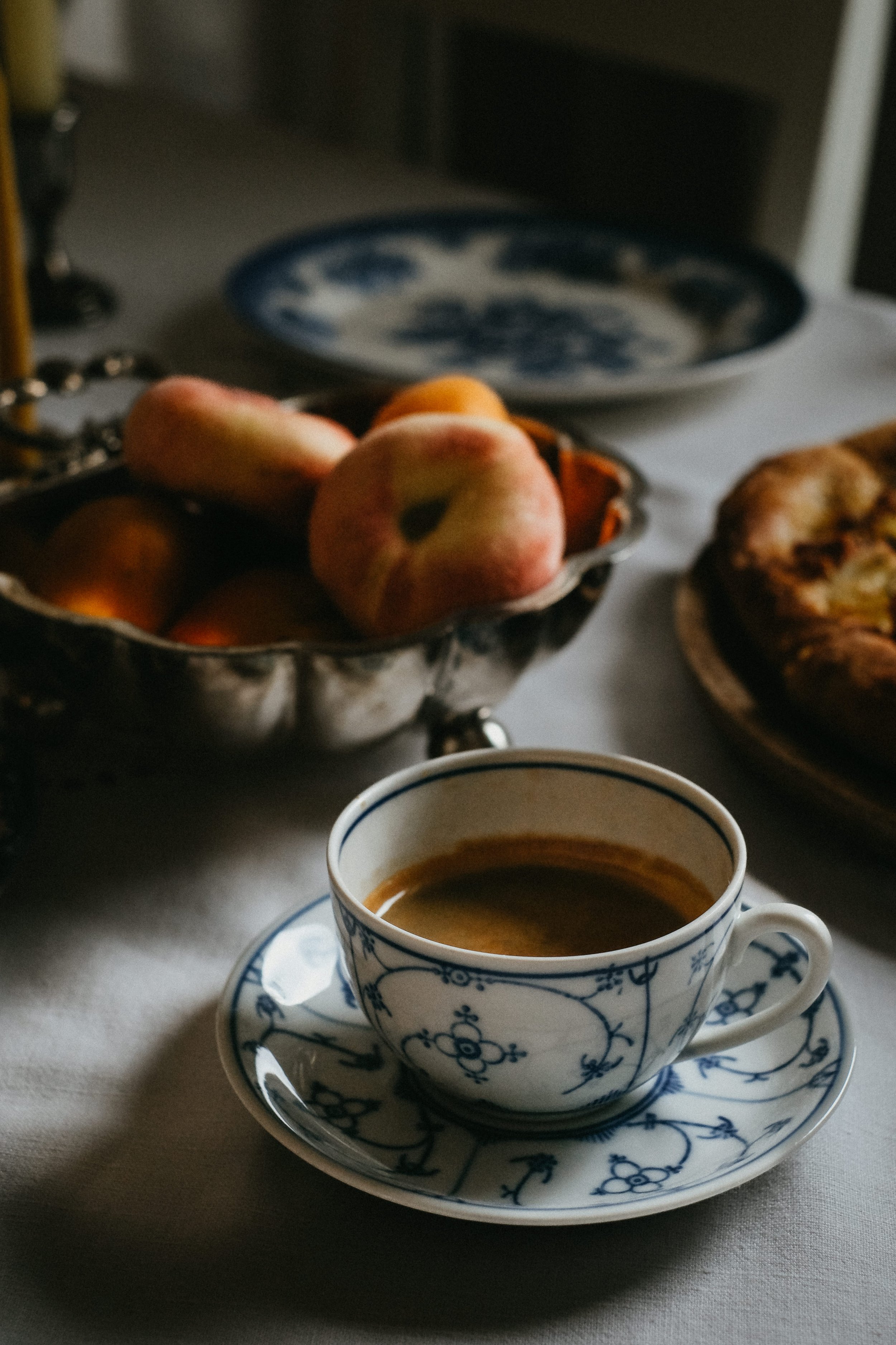 antique porcelain coffee cup, moody food photography