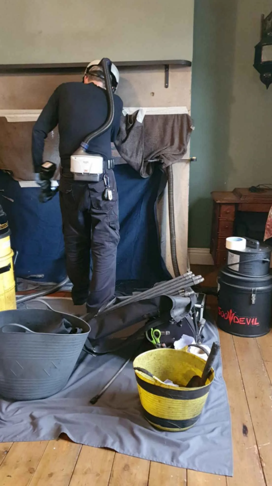 NE Sweep doing a sweep prior to a new stove installation. Sheets and vacs being used to make sure the room stays clean