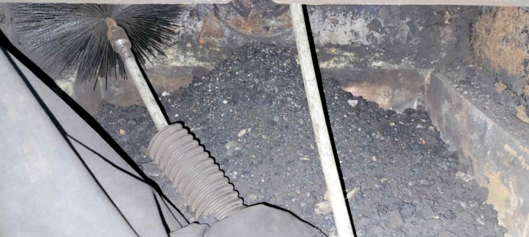 A large amount of soot and creosote being removed from a flue in Cramlington