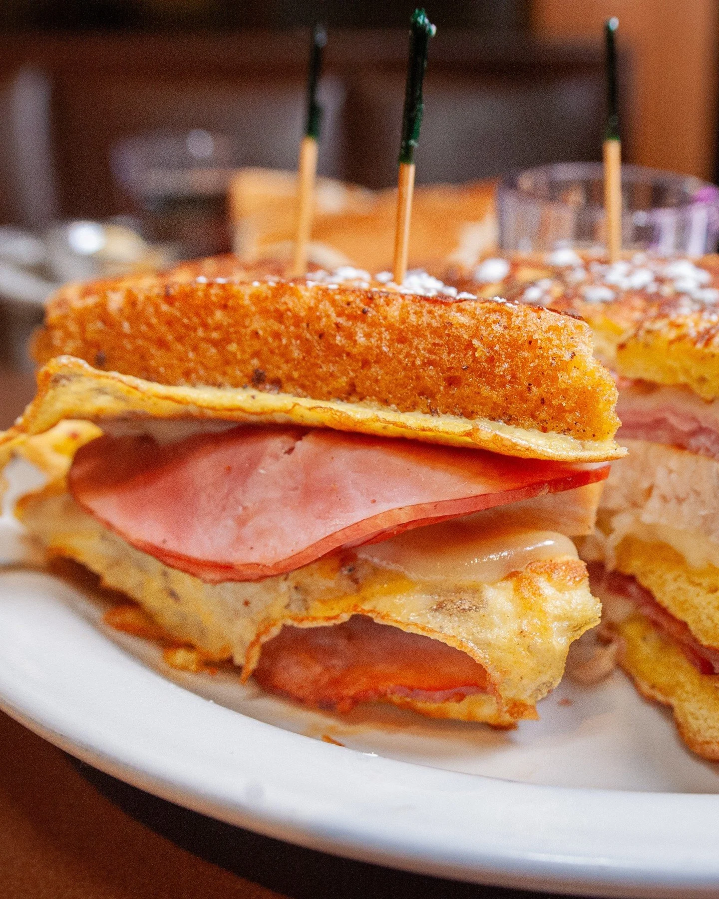 French toast, turkey, ham, and Swiss cheese, stacked to perfection with some syrup on the side... The Monte Cristo! ⁠
⁠
Hats off to the genius behind this timeless diner favorite 🎩