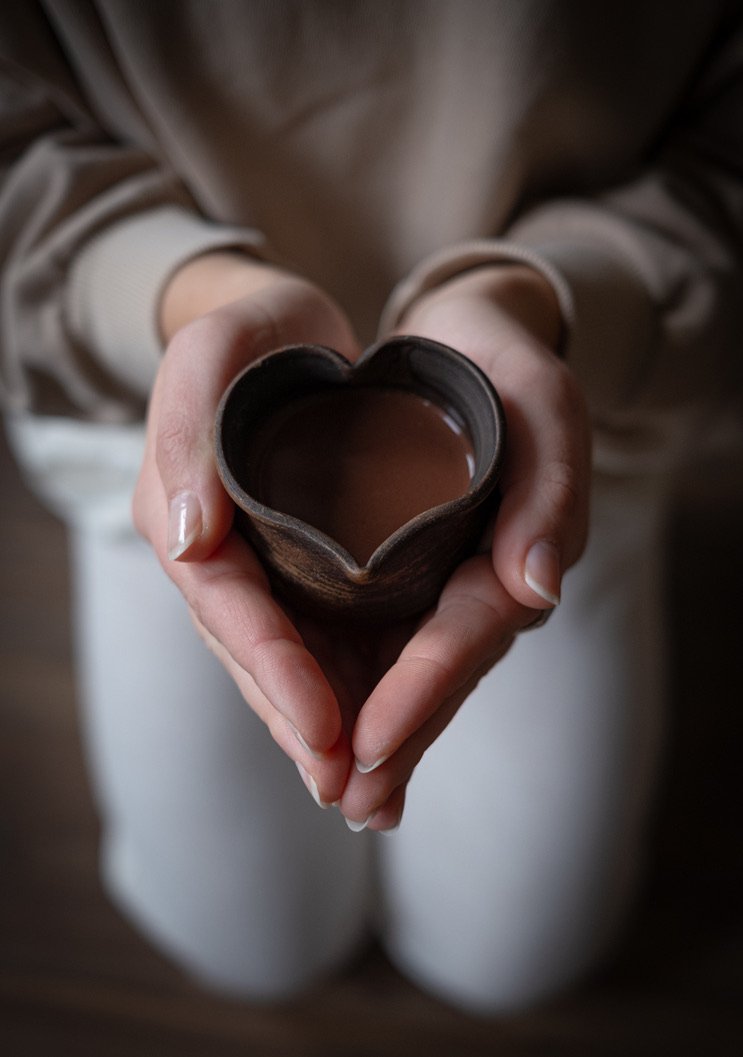 heart-cacao-brew-held-hands