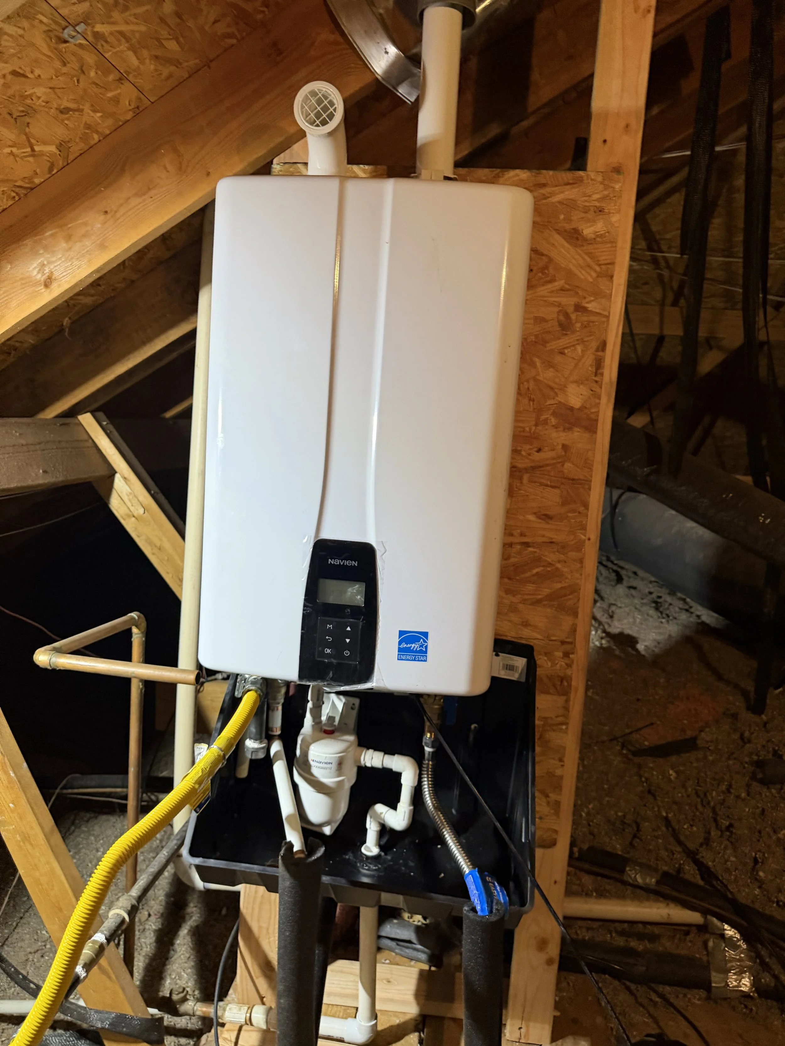Navien tankless water heater installed by Plumb Quick in a DFW home