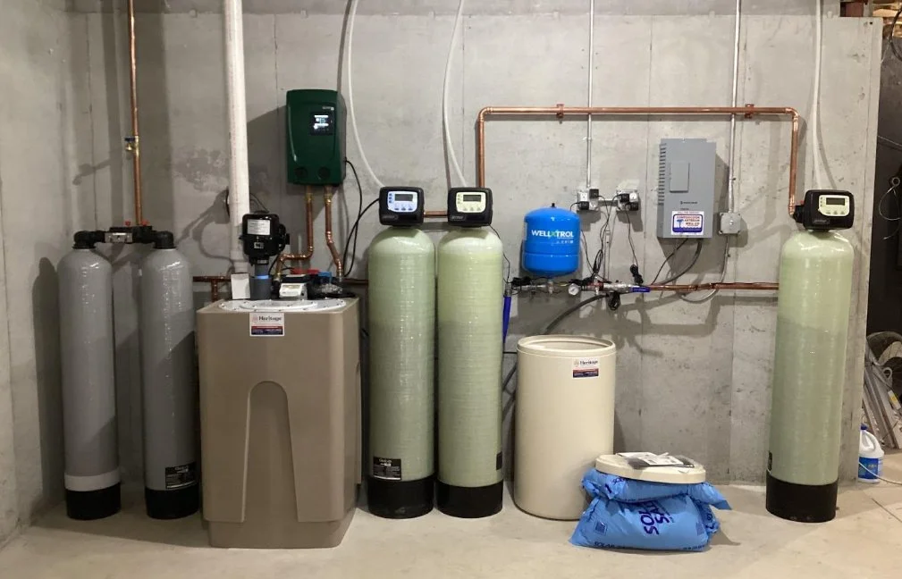 Licensed plumber installing whole house water filtration and water softener system Dallas Fort Worth TX