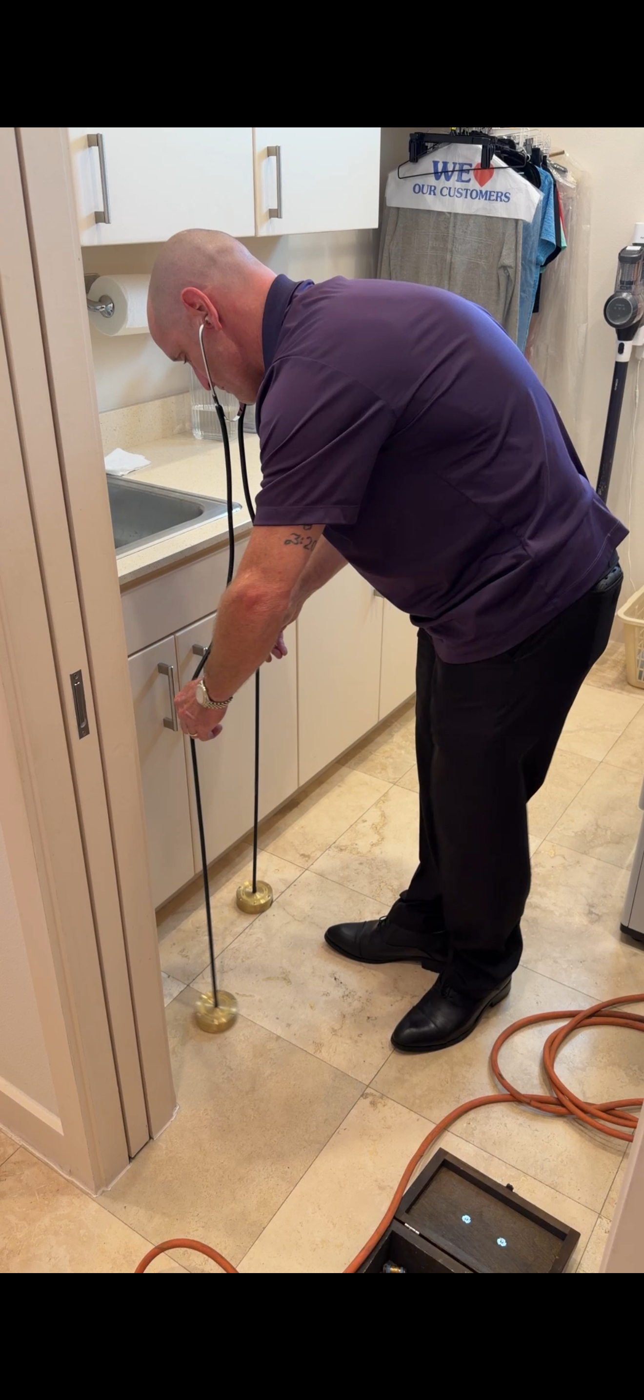 Technician performing slab leak detection service in Plano Texas