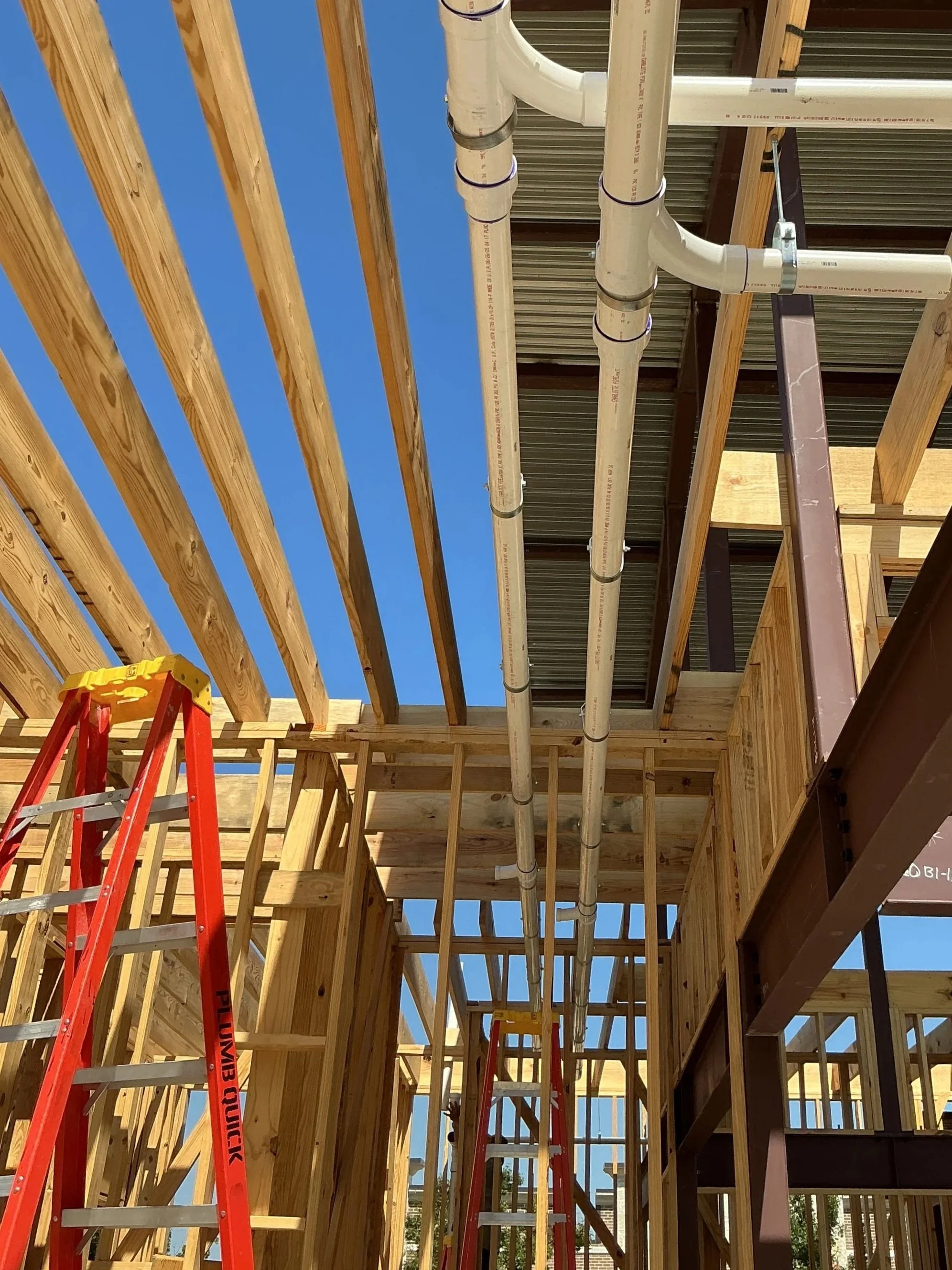 Residential plumbing rough-in installation in new construction home Dallas TX