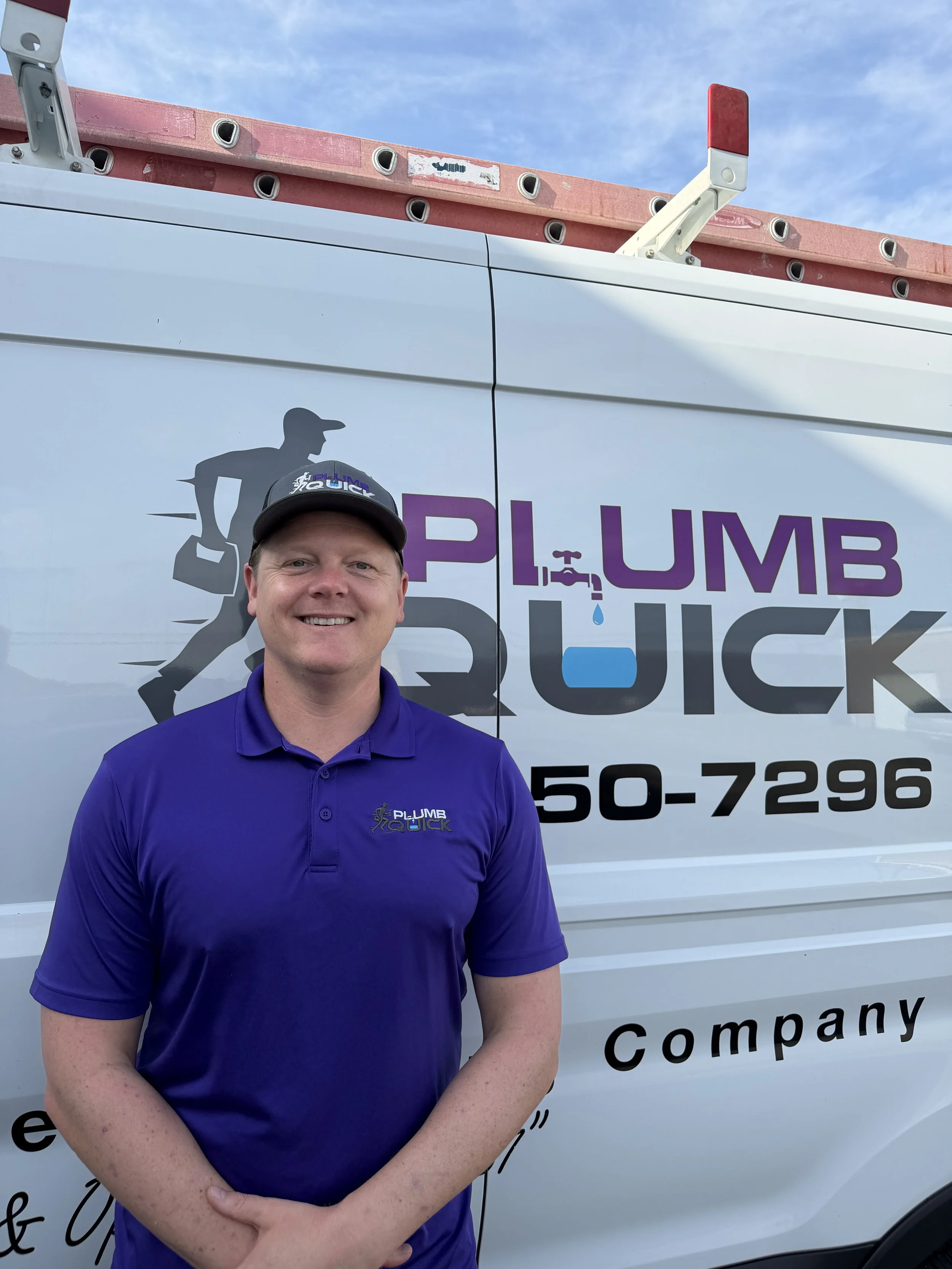 Robert Lacey, owner of Plumb Quick, standing in front of a Plumb Quick service vehicle