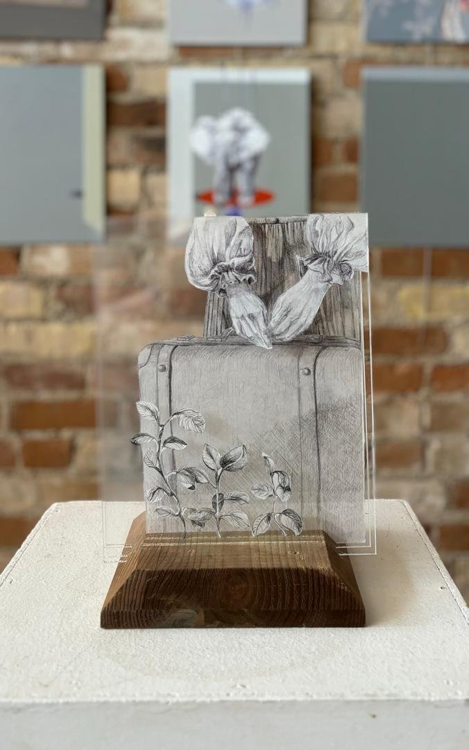 Mixed media on plexiglass plates on a wooden base