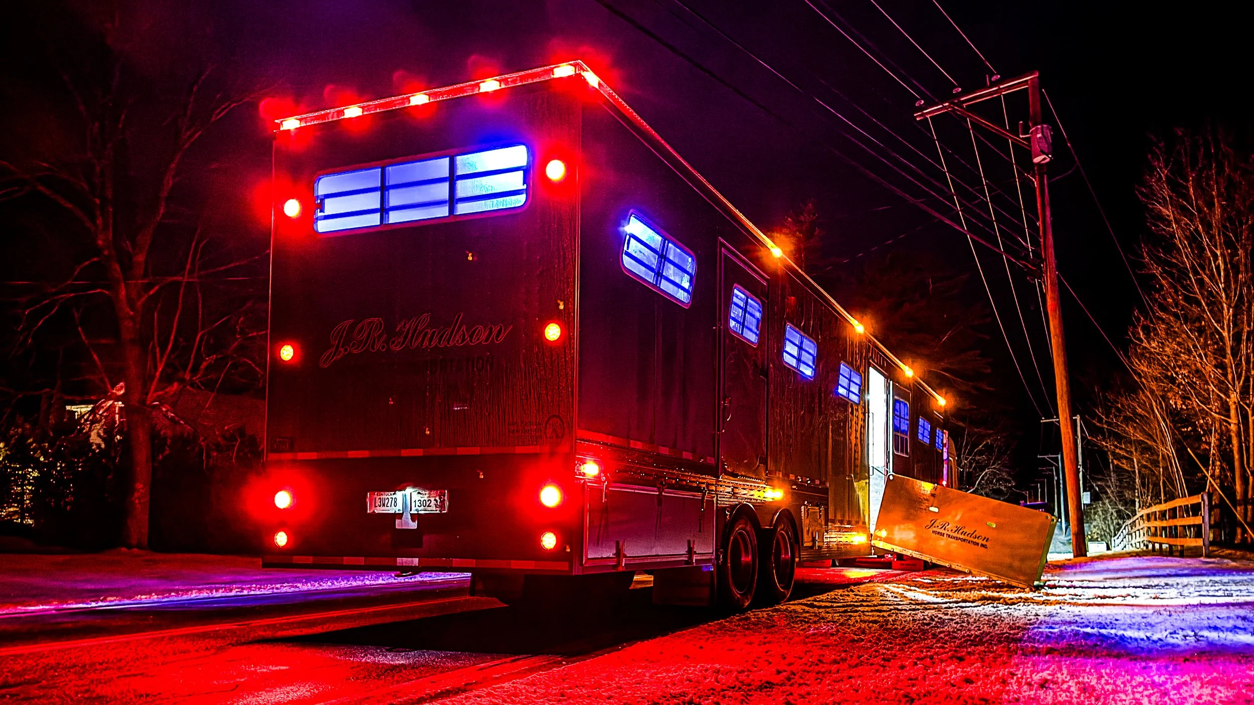 J.R. Hudson Horse Transportation loading a horse in the snow in Vermont going to Florida