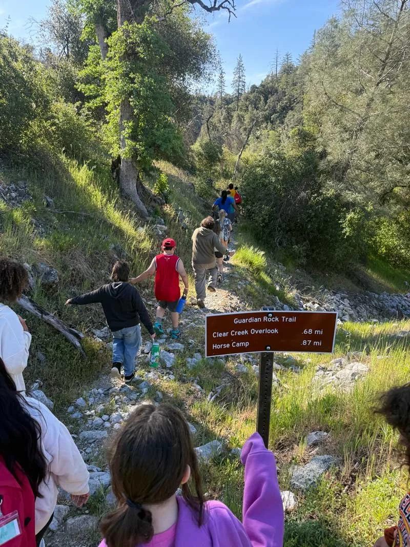 WES community students hiking on outdoor trail