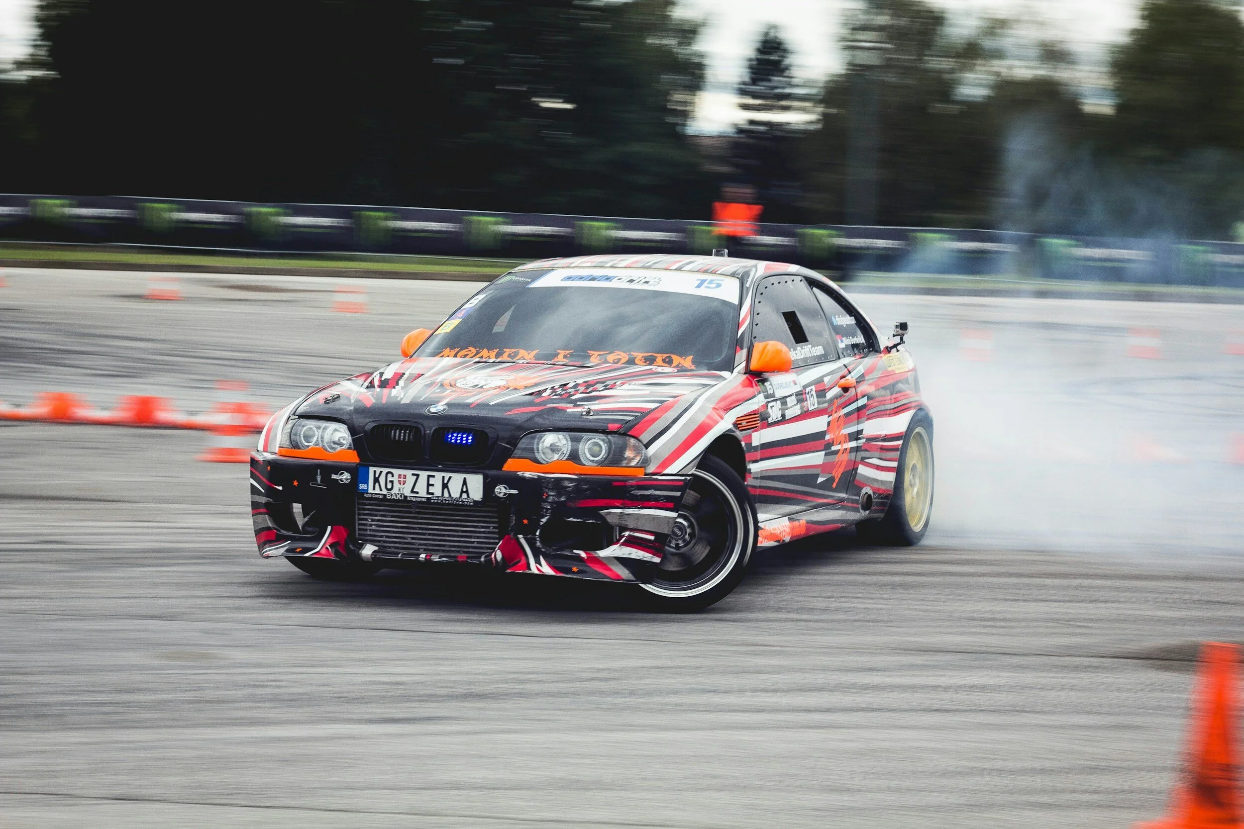 Race car drifting on a track, representing OffGround Studio live event and motorsport coverage