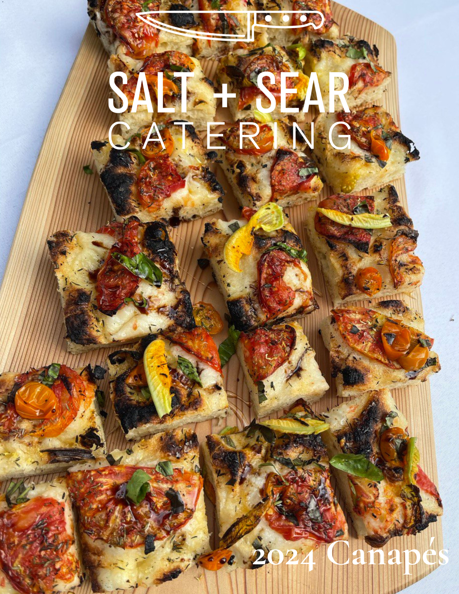 Assorted rectangular canapés with roasted tomatoes, herbs, and crusts, displayed on a wooden board with 'Salt + Sear Catering 2024 Canapés' text overlay.