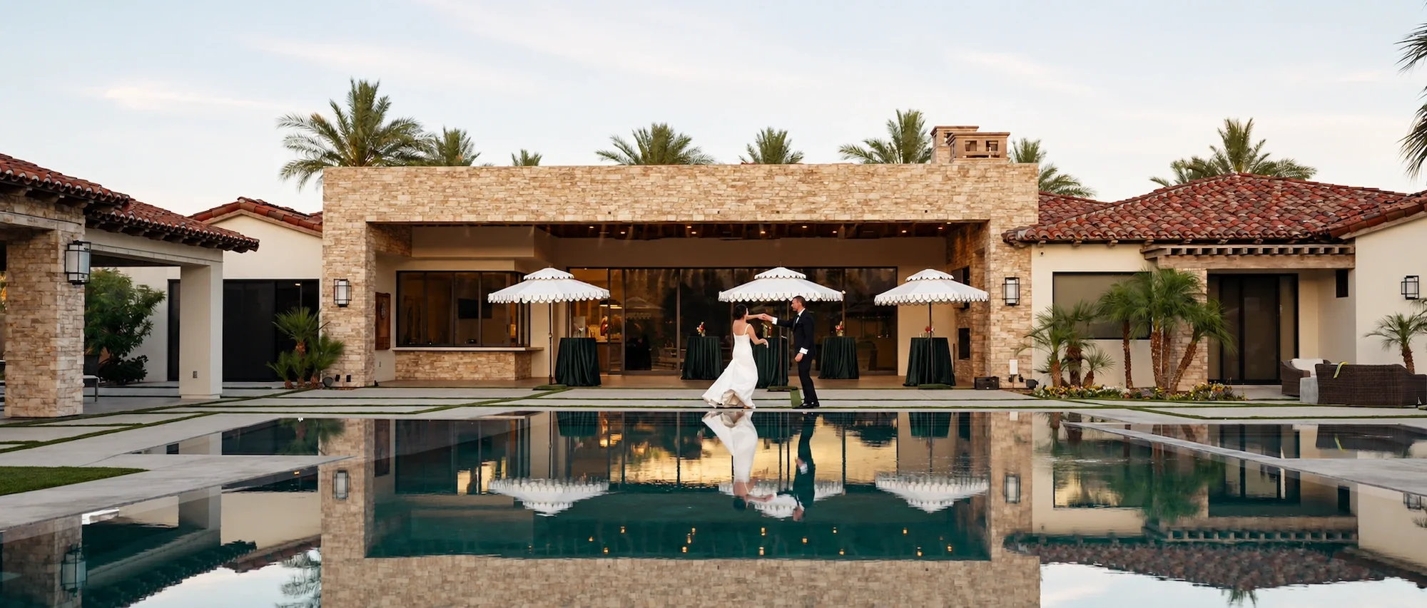 Kristin_and_Brian_Palm_Springs_Wedding_Dancing_at_Pool.webp