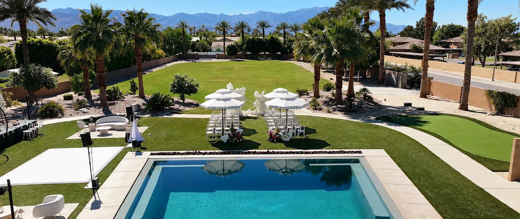 Kristin_and_Brian_Palm_Springs_Wedding_Aerial_Shot_Above_Pool.webp