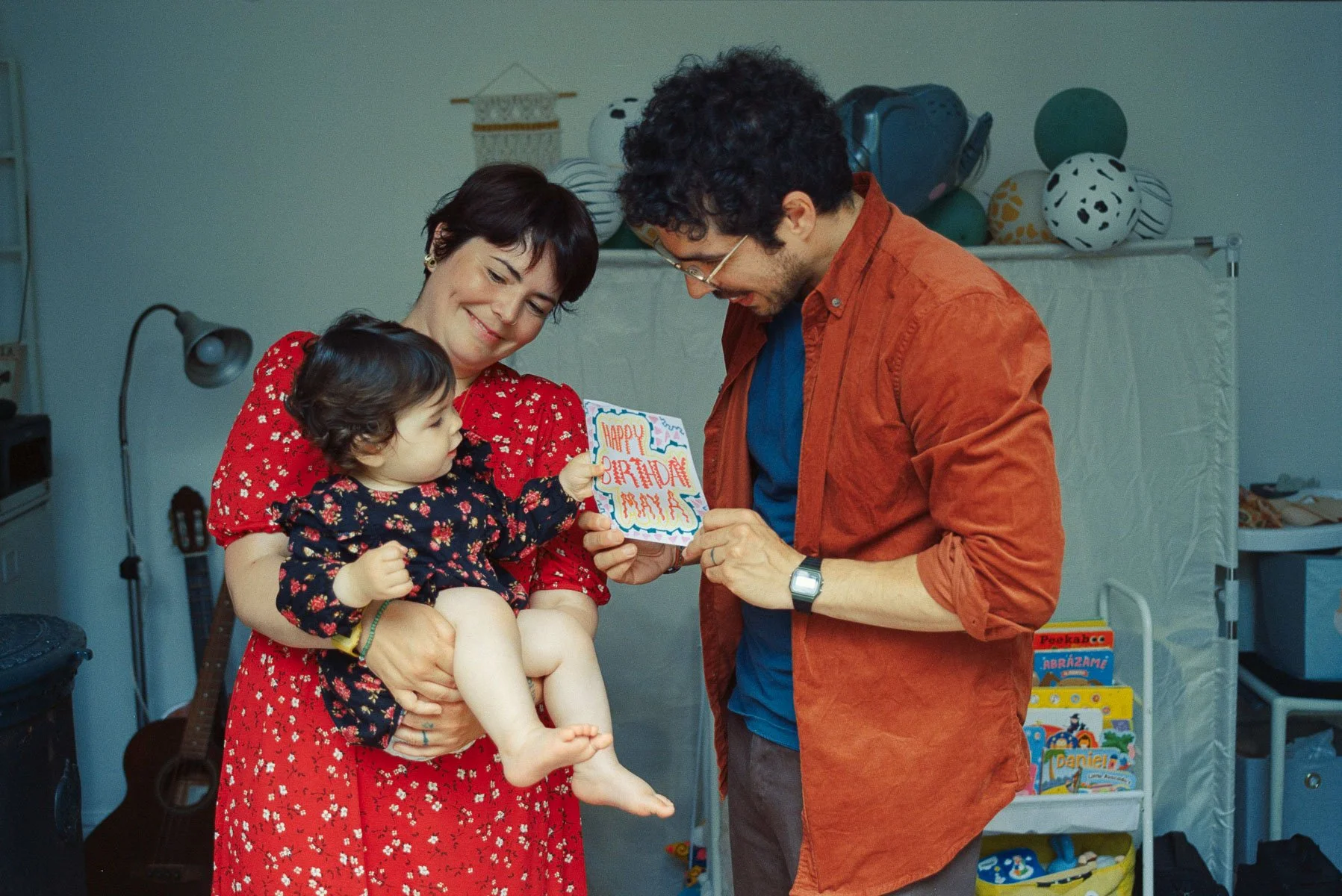 Before and after comparison of a Dublin couple wearing the same outfits for their maternity and 1st birthday film sessions.