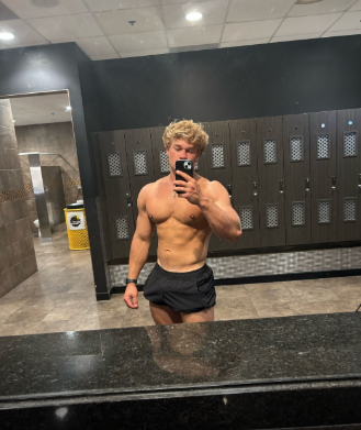 Pure Potential Fitness client progress photo in gym locker room