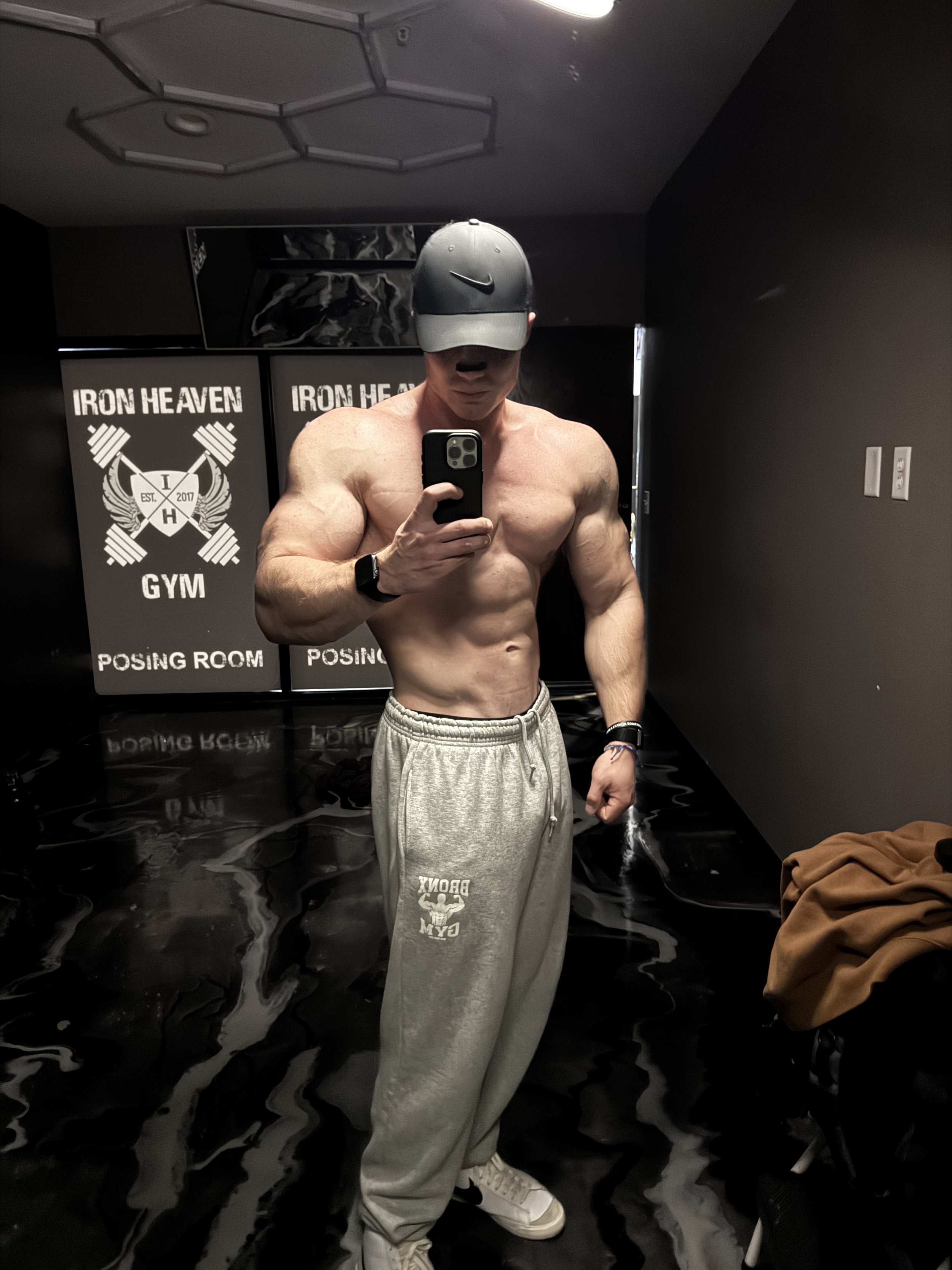 Online physique coach training and posing in gym environment
