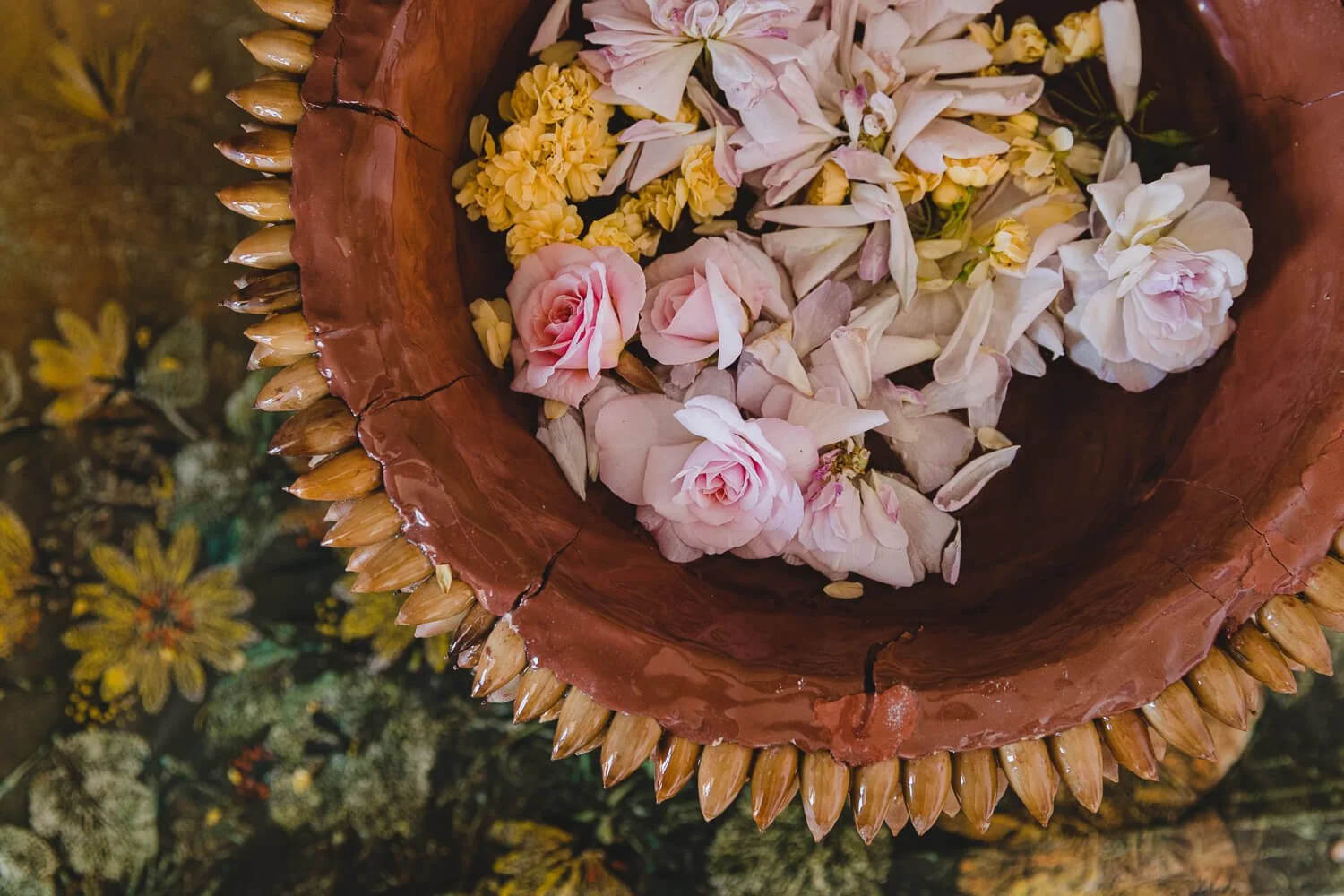 Acorn lined bowl with pink roses, an art piece by artist Danielle Mourning.