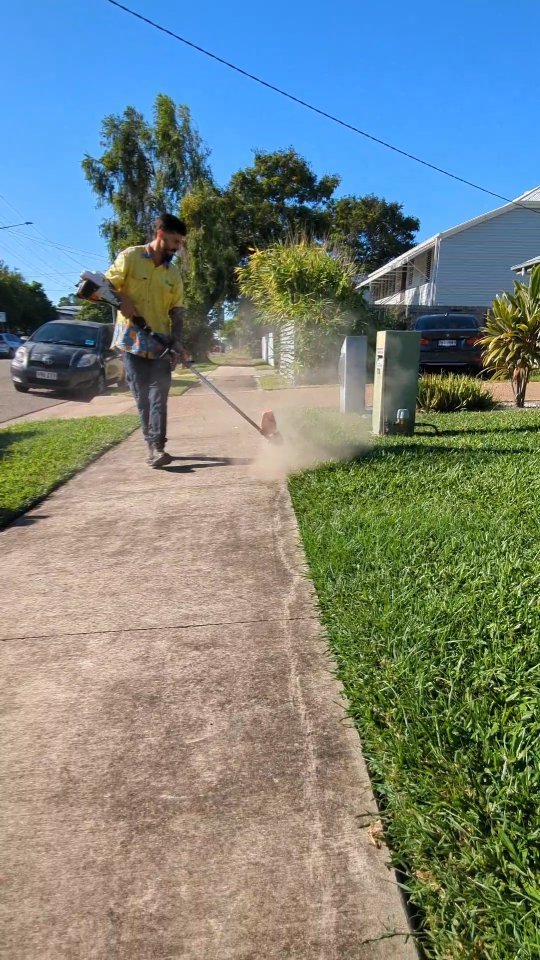 "Master of the perfect lawn edge game – where grass meets precision! 🌱✂️ #EdgingPro #LawnLinesForDays #townsville #lawncare