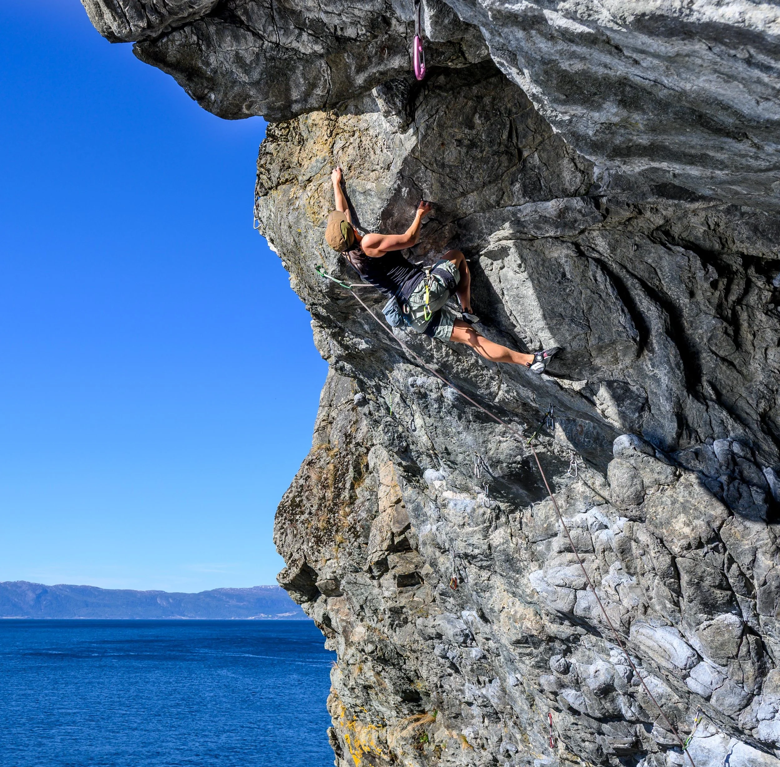 Anna Zhang climbing Den gule flekken (7a) at Korsvika, Trondheim, Norway.